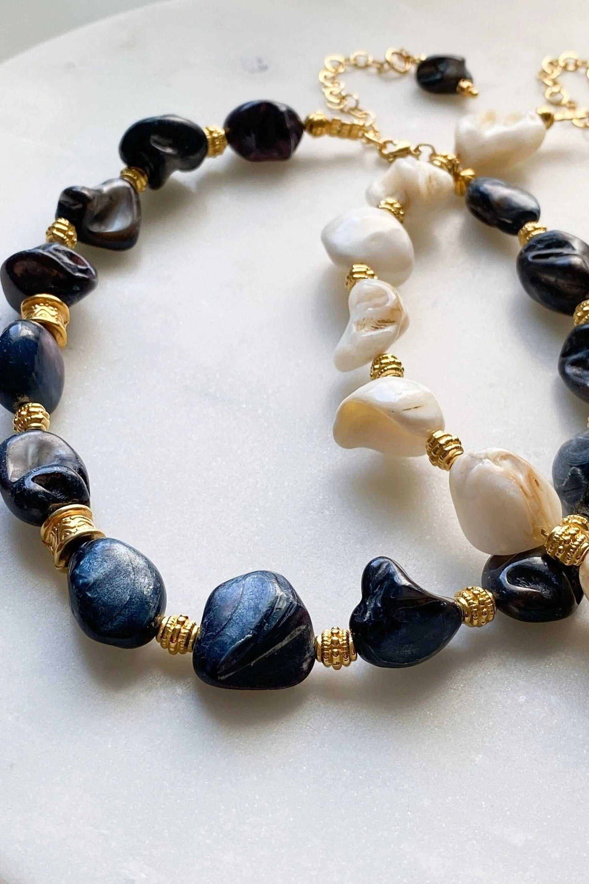 AMAZONA Shell Necklace with large irregular black, blue and white natural shell beads and gold-tone accents