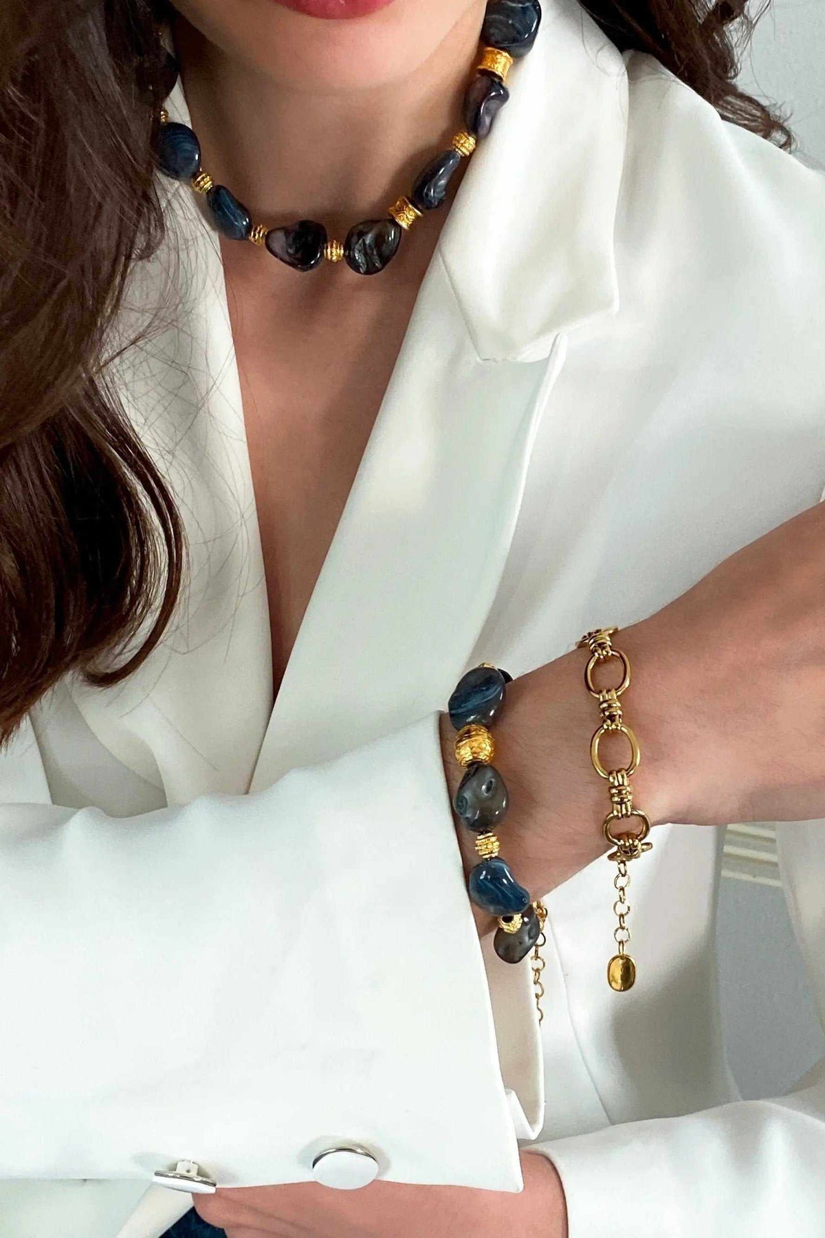 AMAZONA Shell Necklace with dark blue and black shell beads, gold-tone links, and matching bracelet