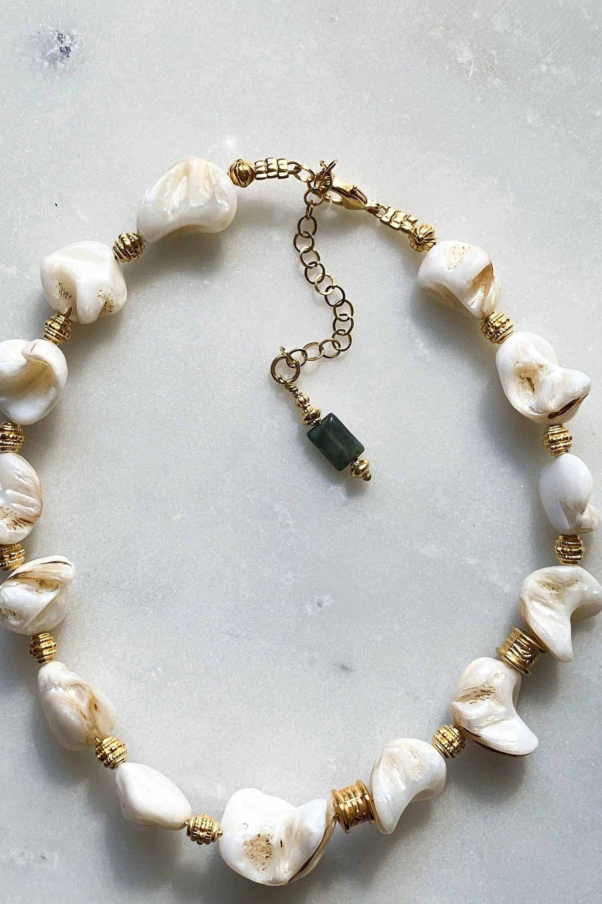 AMAZONA Shell Necklace with white natural shell beads, gold-tone wire accents, and extender chain