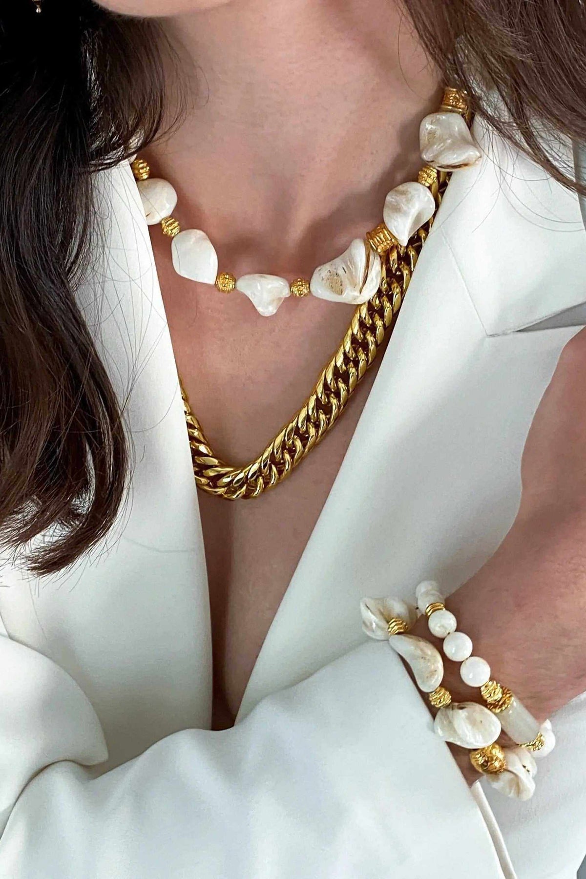 AMAZONA Shell Necklace with large white natural shell pieces, pearl accents, and gold-toned chain details