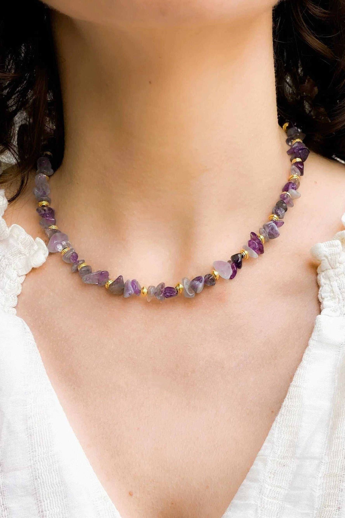 Amethyst necklace with natural purple crystal chips, faceted stones, and gold-toned spacer details