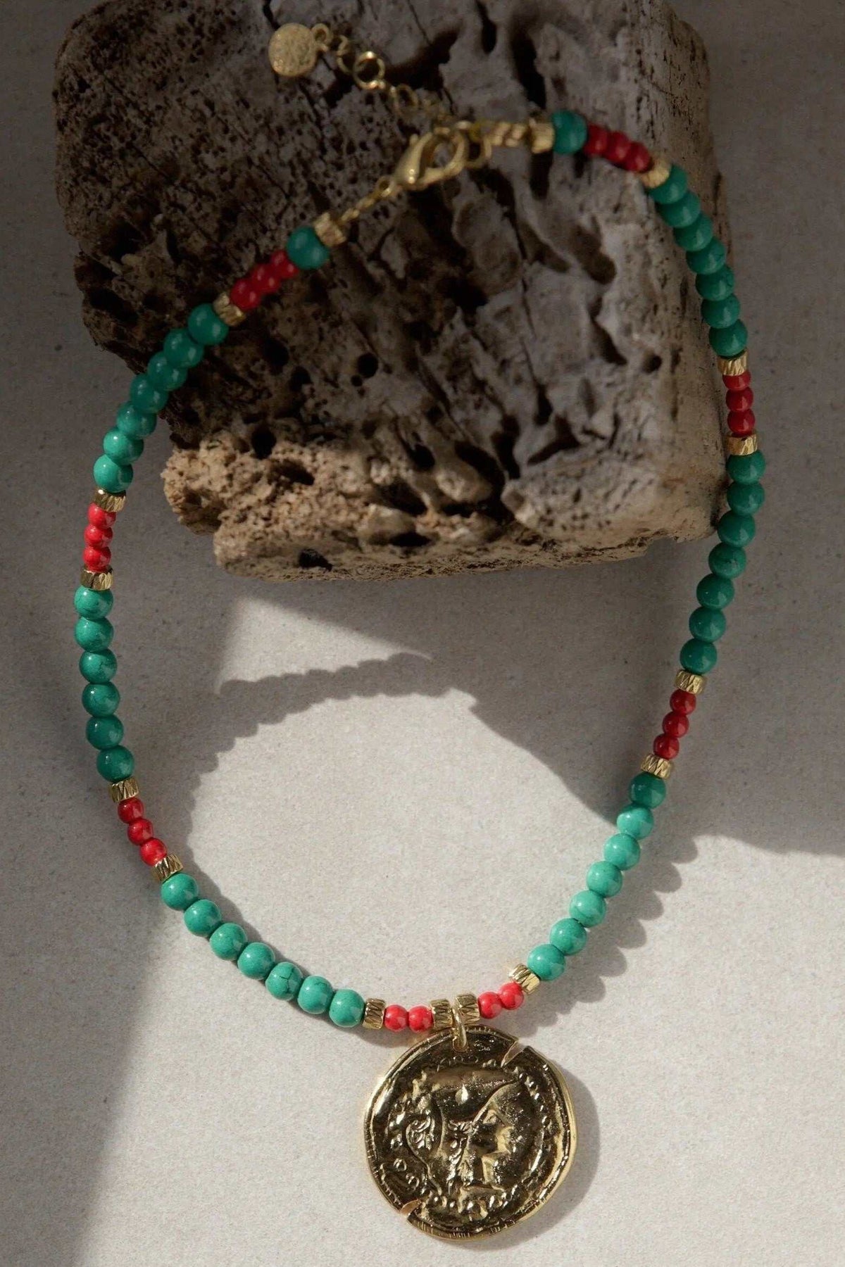 Ancient coin NECKLACE with turquoise-green and red beads, gold-tone chain details and a round embossed coin pendant