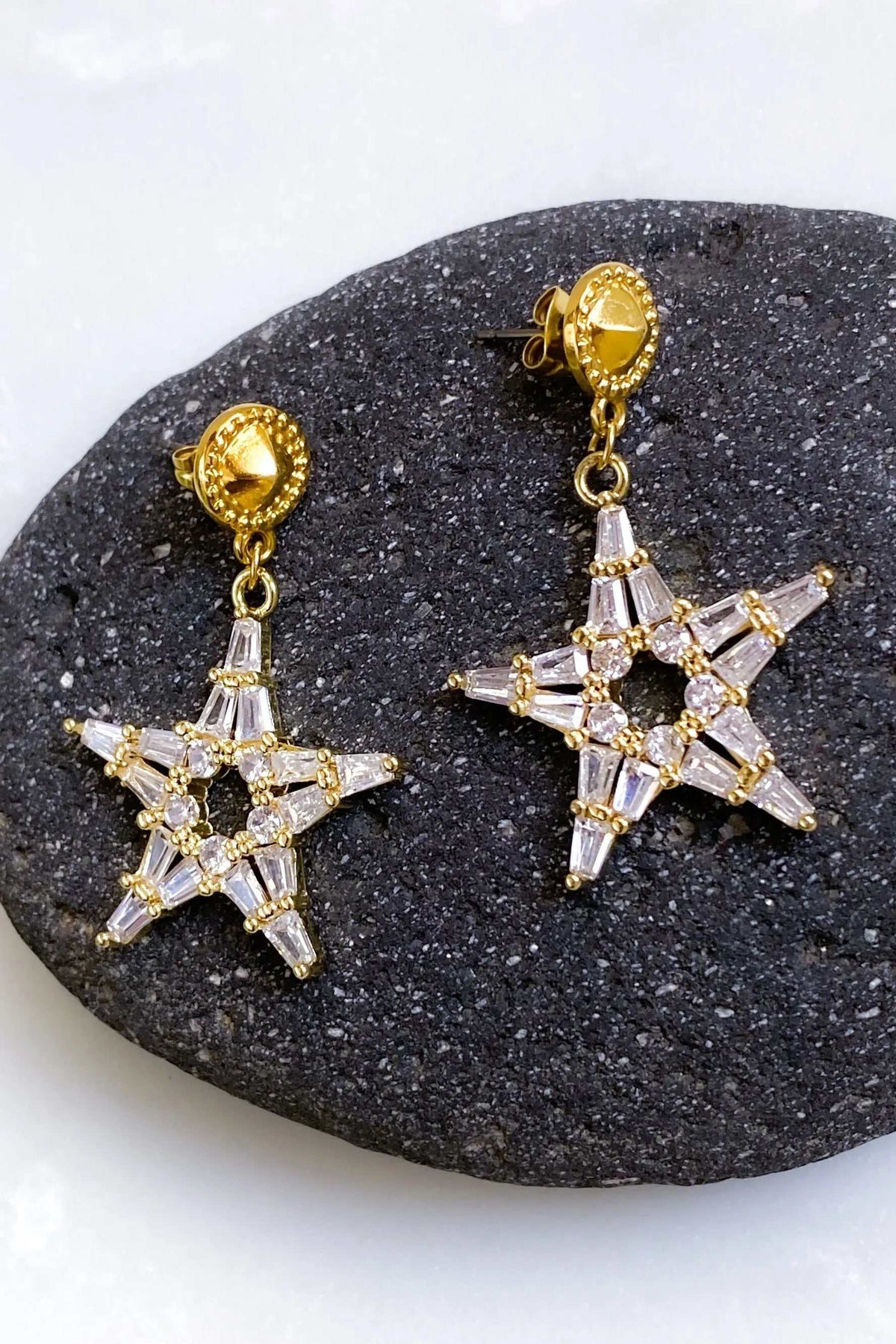 ANDROMEDA Earrings are gold-plated star earrings with clear zircon crystals and round decorative studs