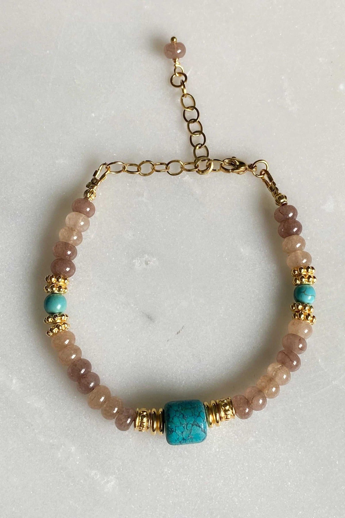 ARETI Bracelet with pale pink agate beads, turquoise stones and gold-tone accents, featuring a square centerpiece