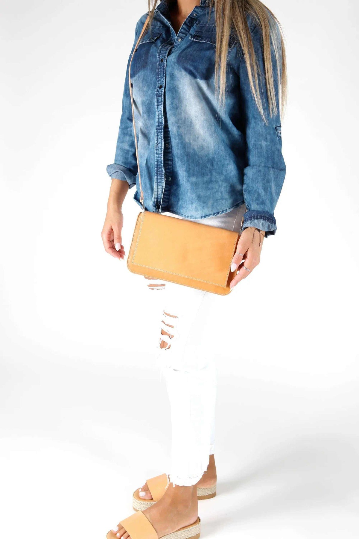 ARION envelope clutch bag in natural tan leather with a smooth finish, slim rectangular shape and long shoulder strap