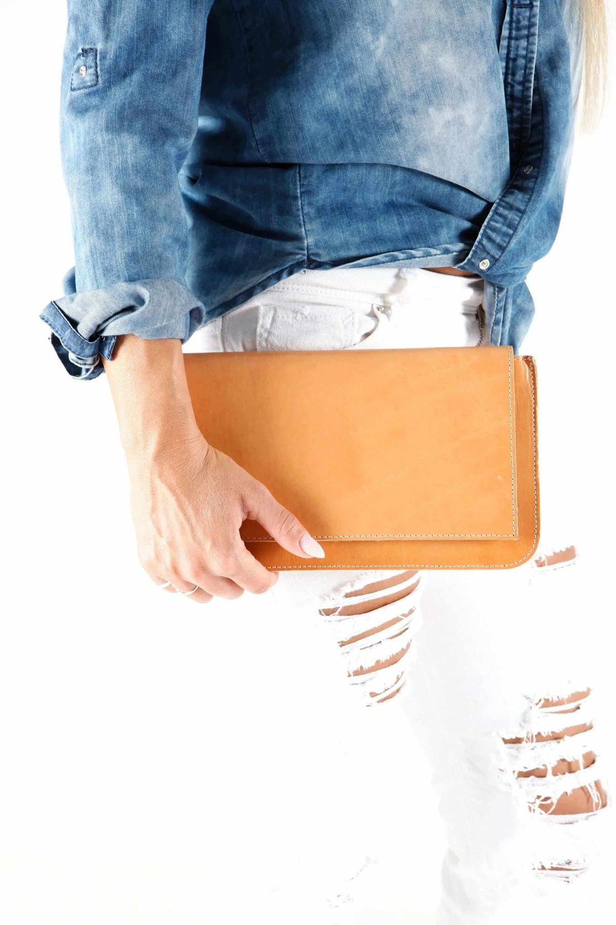 ARION envelope clutch bag in tan leather with a large front flap, slim profile and stitched edges