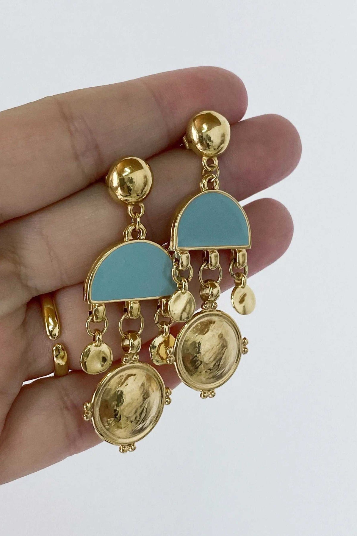 ASTRADENI EARRINGS in gold-tone brass with turquoise semicircles, dangling gold charms and round sculpted discs