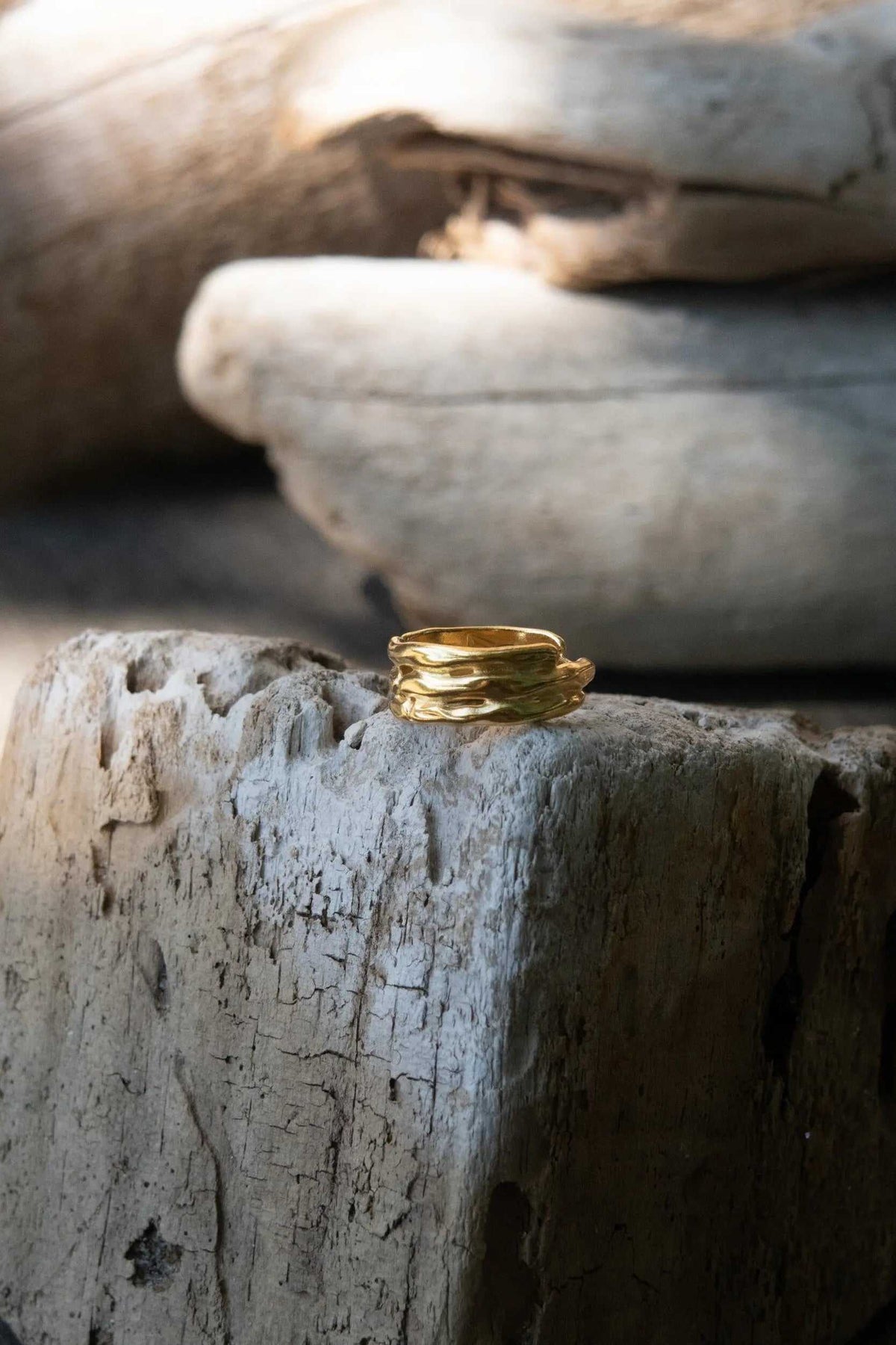 Bamboo pattern RING in a gold-tone finish, featuring an adjustable sculpted band with layered bamboo-like ridges