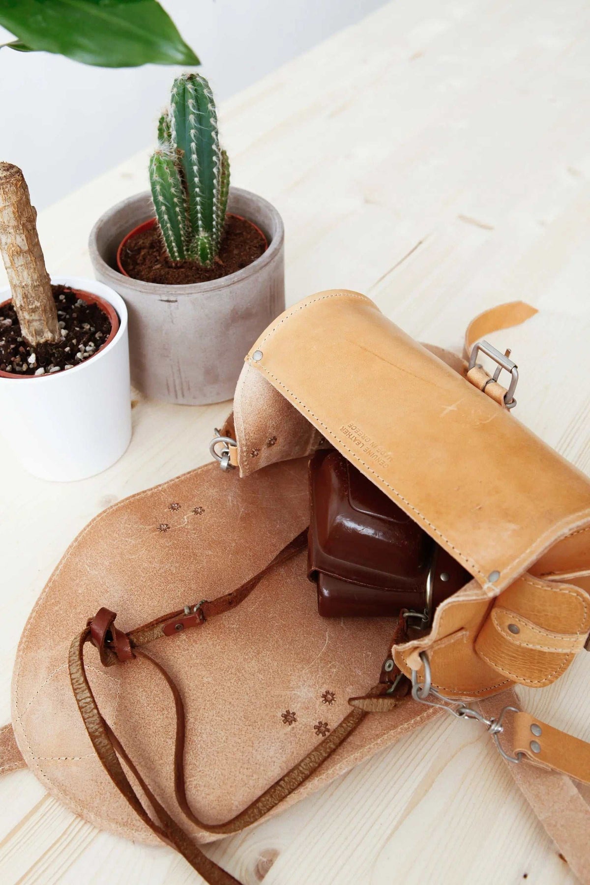 BARREL BAG with pockets in natural tan leather, open barrel-shaped design showing roomy interior and adjustable strap