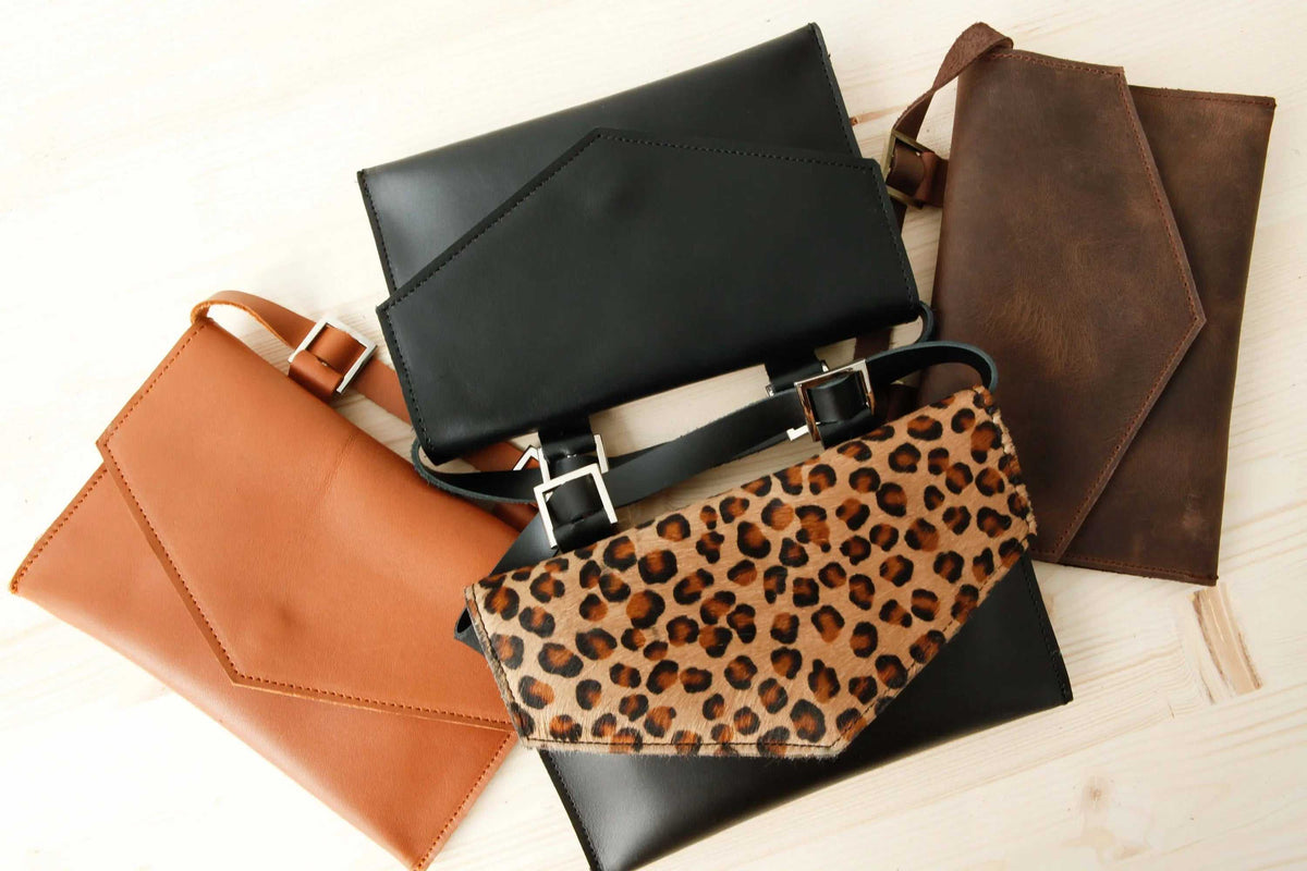 belt bag set in black, brown, camel and leopard-print leather with angular flaps and adjustable straps