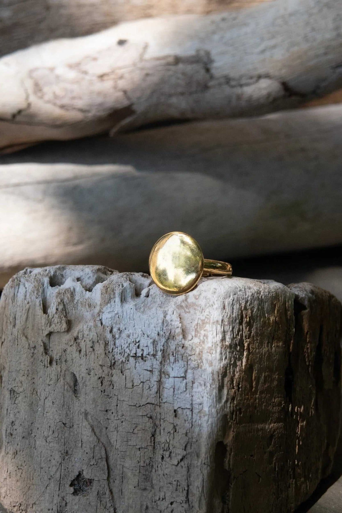 BIG Round RING in shiny gold-tone metal, featuring a large smooth circular face and an adjustable narrow band