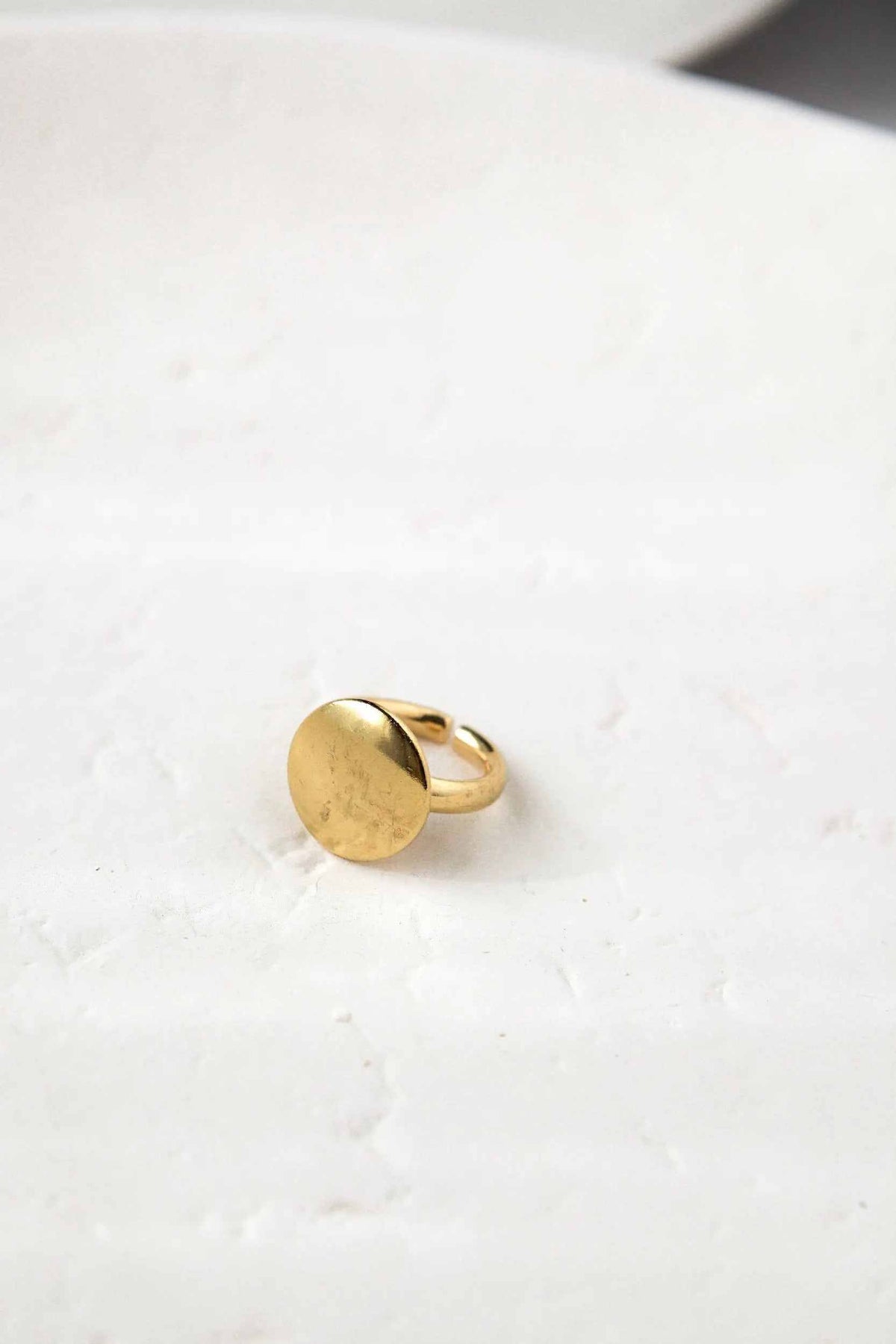 BIG Round RING in polished gold-tone metal, featuring a smooth, flat circular face and an adjustable band