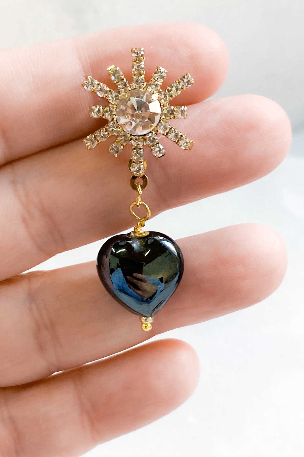 BLACK crystal Heart Earrings with glossy black heart bead and sparkling gold-tone crystal sunburst charm