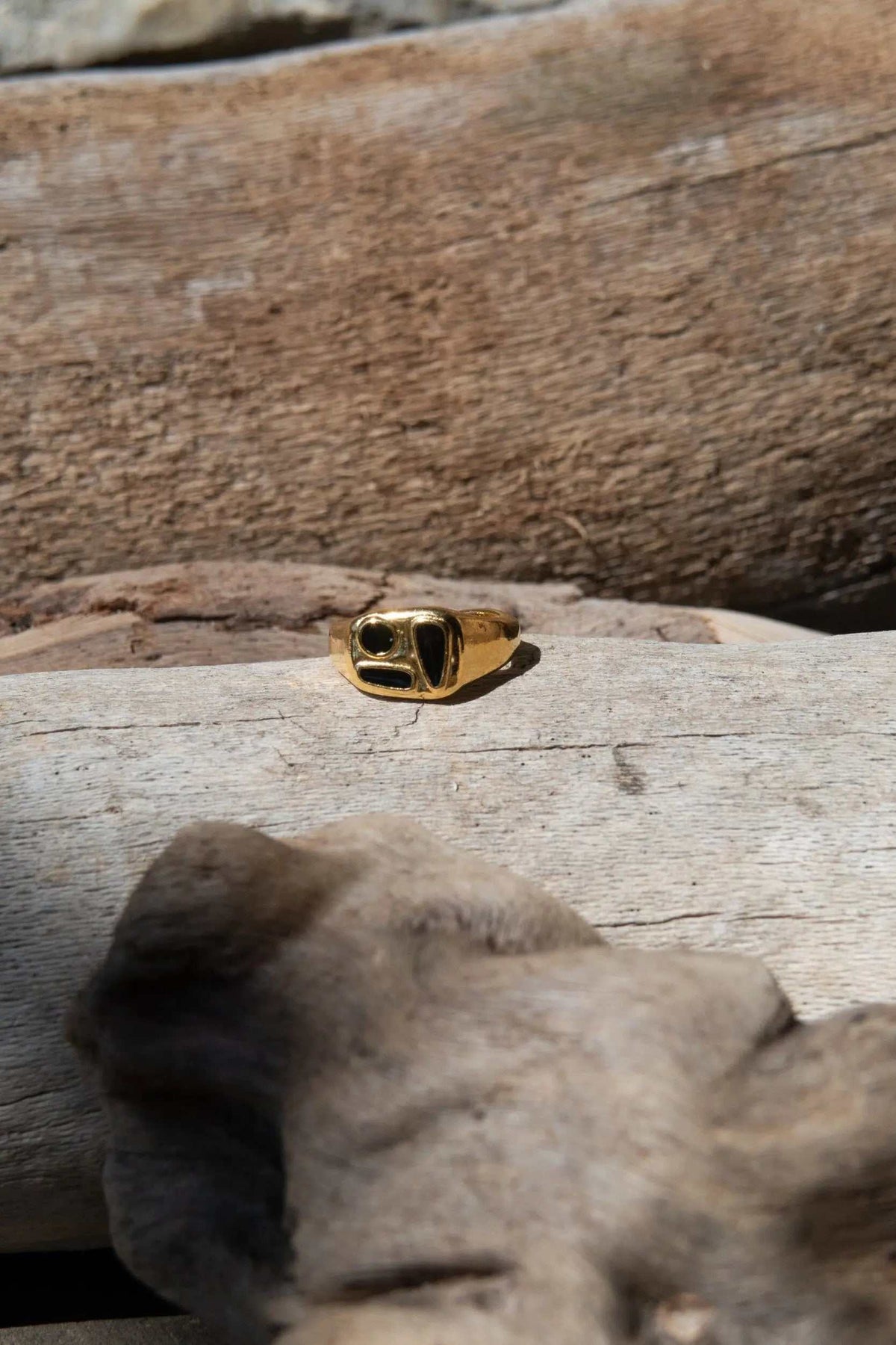 Black Forms Stamp RING featuring a gold-tone band with a raised black rectangular face and sculpted edges