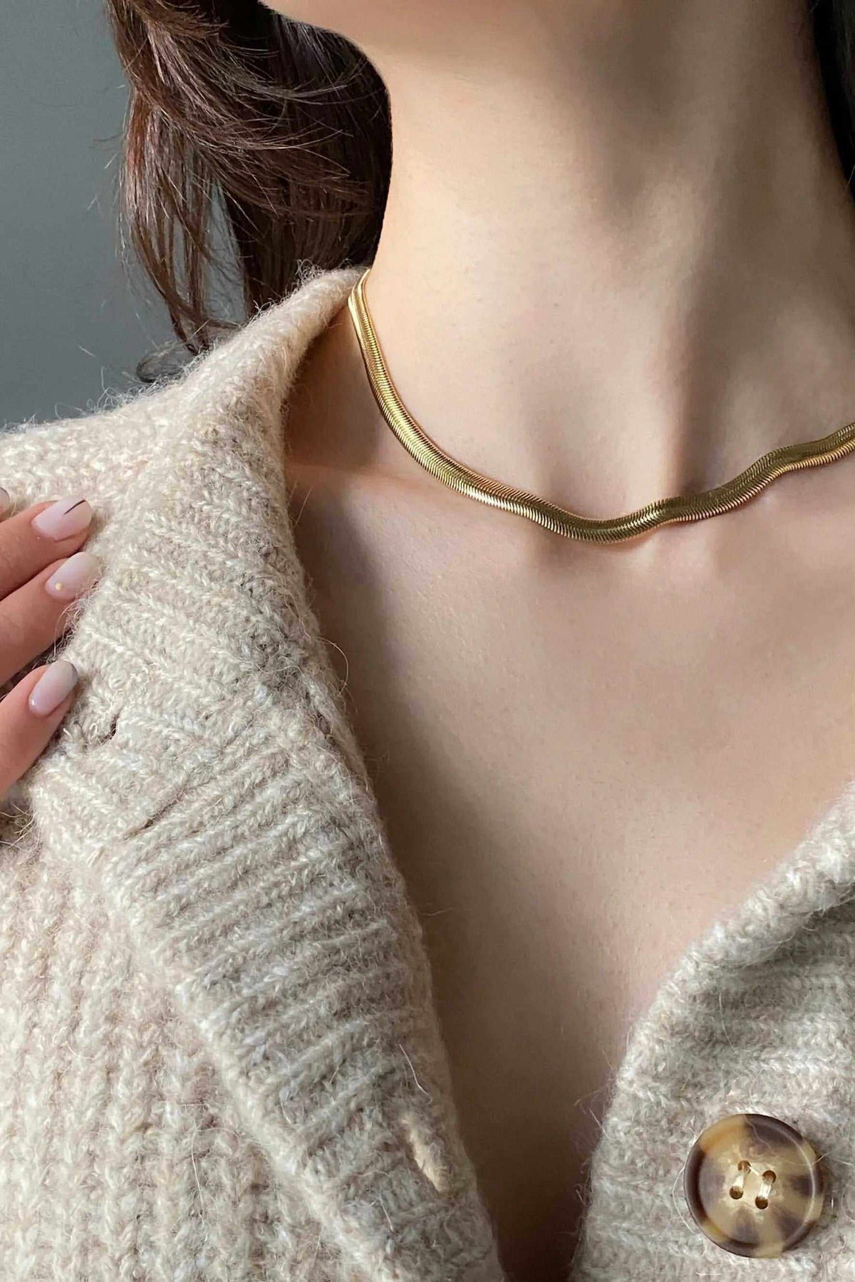 Chain Necklace in gold-tone metal with a smooth flat snake chain and delicate minimalist design