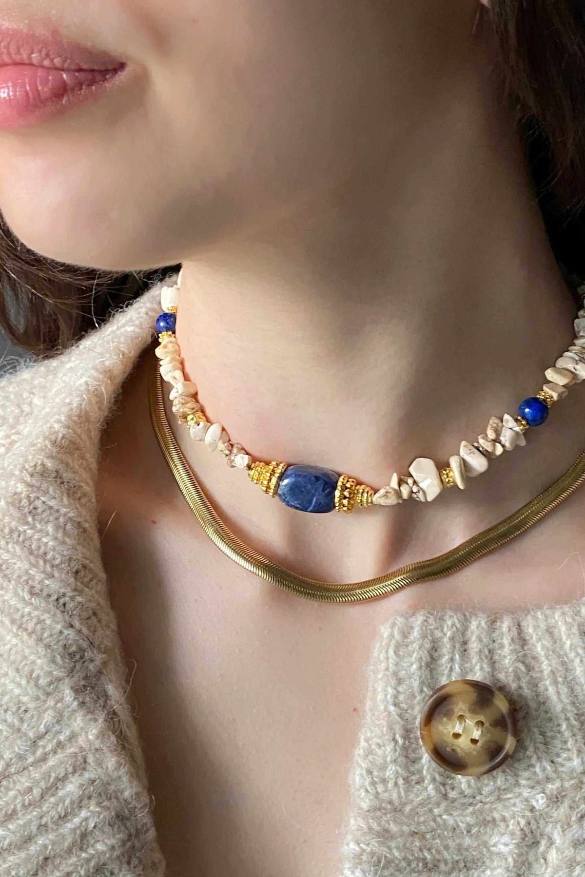 Chain Necklace in gold-toned metal with a smooth flat snake chain and delicate choker design