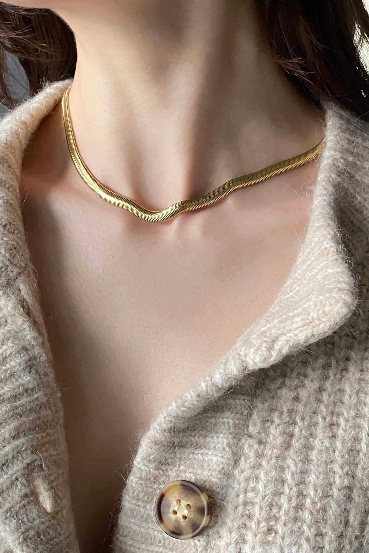 Chain Necklace in gold-tone metal with a smooth flat snake chain and minimalist choker design
