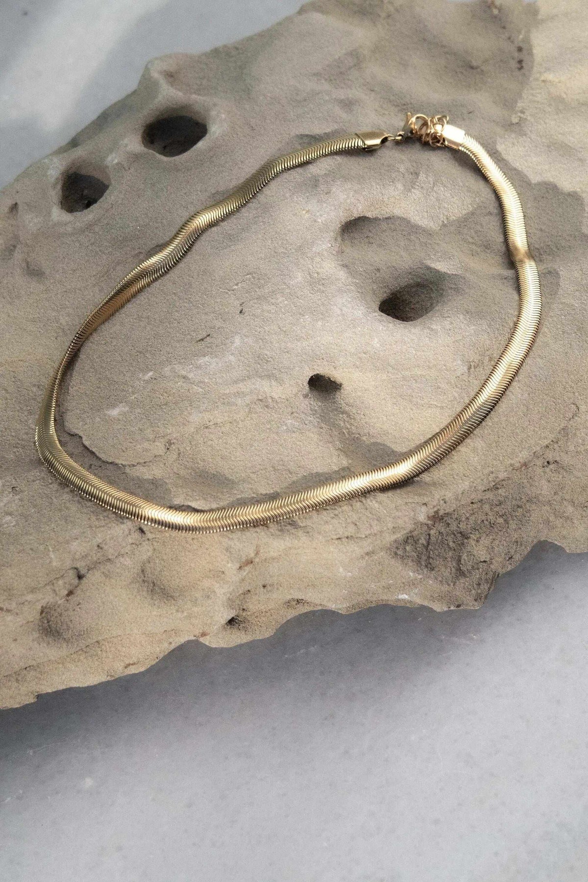 Chain Necklace in gold-tone metal with a smooth snake chain design, delicate tubular finish and lobster clasp