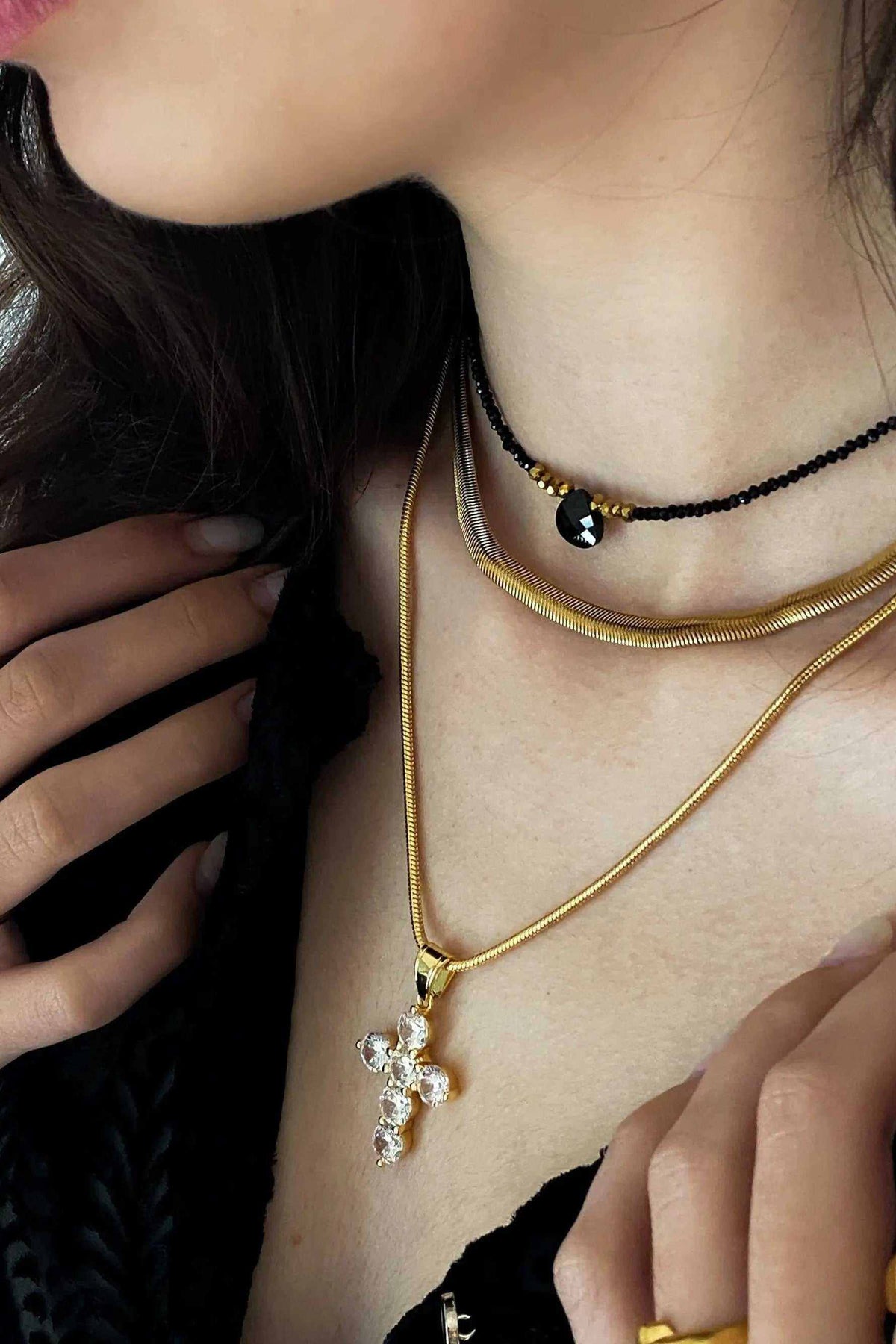 Chain Necklace in gold-toned metal with a slim snake chain, shown layered with a pendant necklace