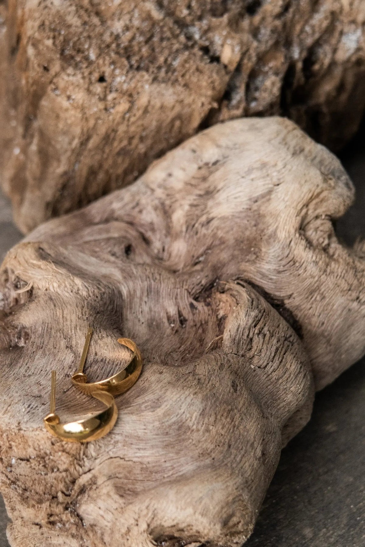 Crescent moon Hoops in polished gold-tone metal, curved open hoops with slim posts and rounded ends
