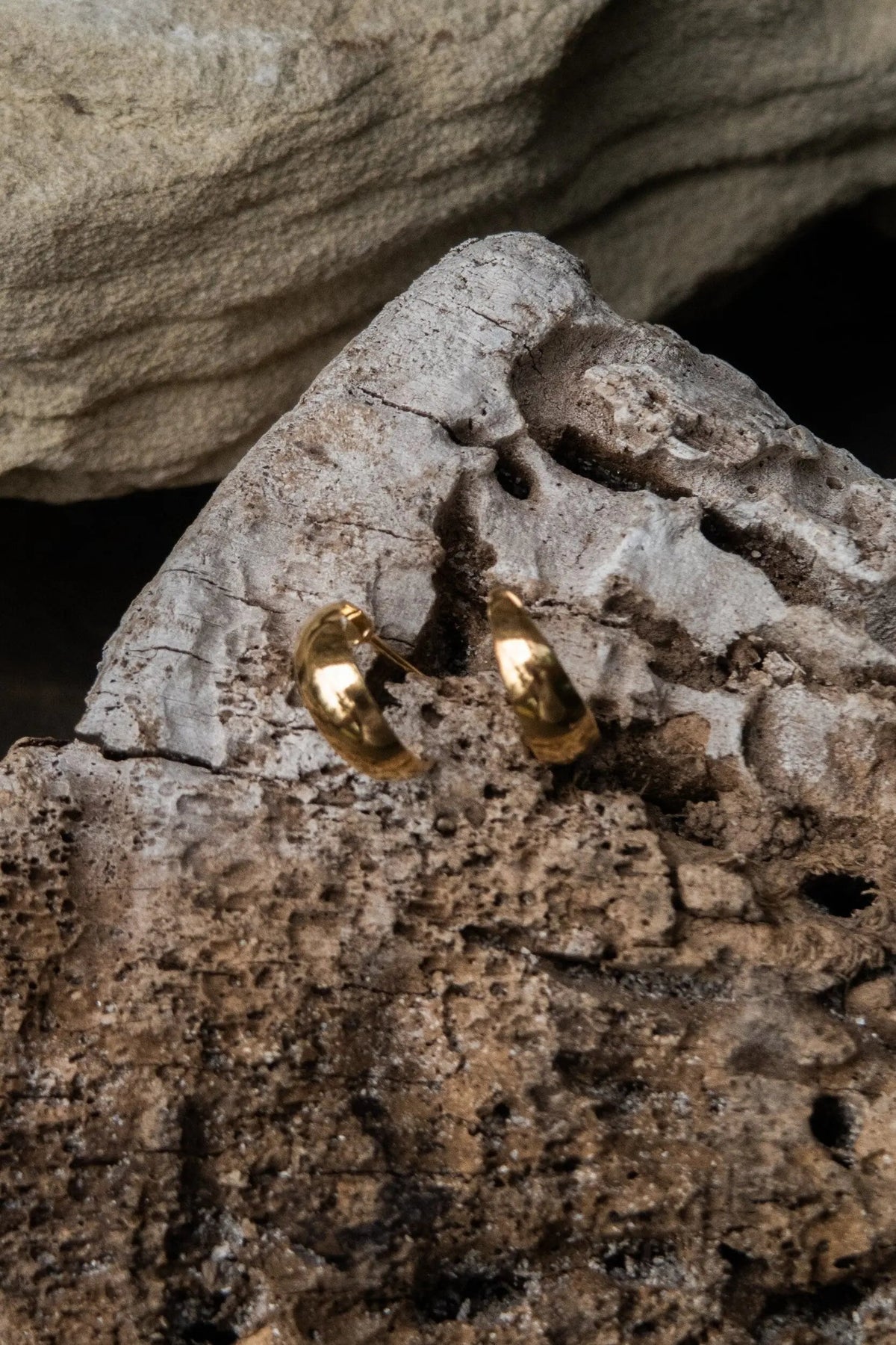 Crescent moon Hoops in polished gold-tone metal, small curved crescent shapes with a smooth, rounded finish