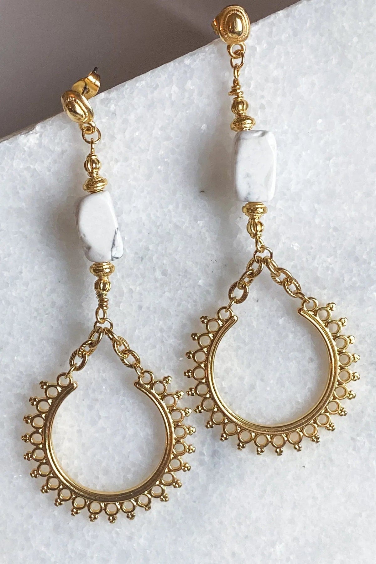 ÉRIS EARRINGS with gold-tone ornate teardrop hoops, delicate dangling chains and white stone accents