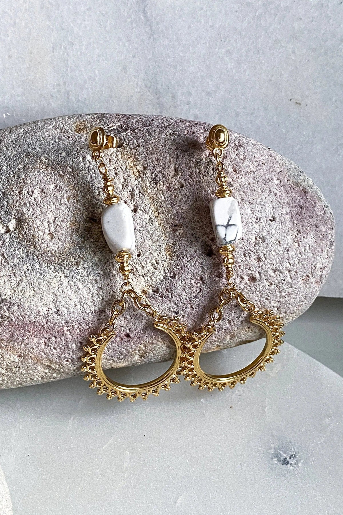ÉRIS EARRINGS in gold-tone metal with white stone beads and ornate open crescent drops edged in tiny details