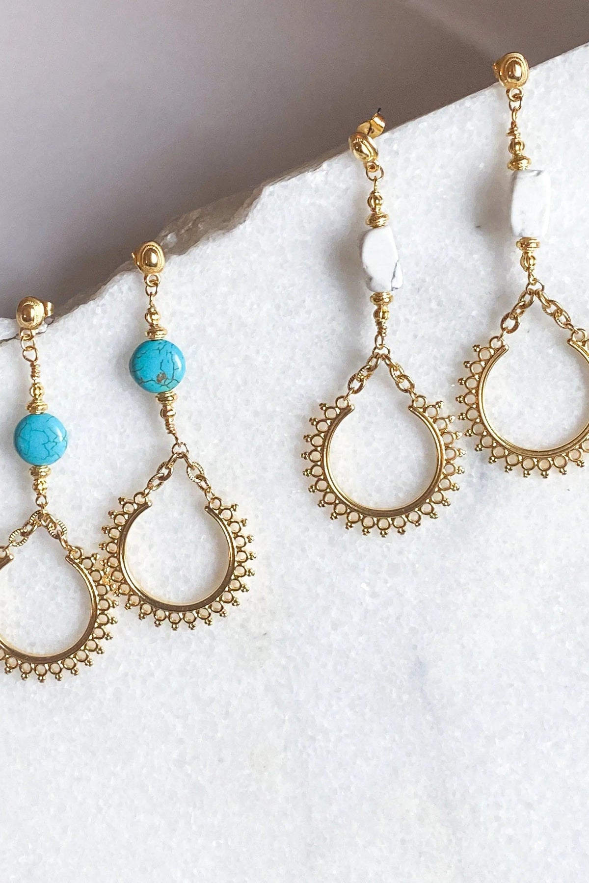 ÉRIS EARRINGS in gold-tone metal with ornate teardrop hoops, turquoise and white stone accents, and delicate chain details