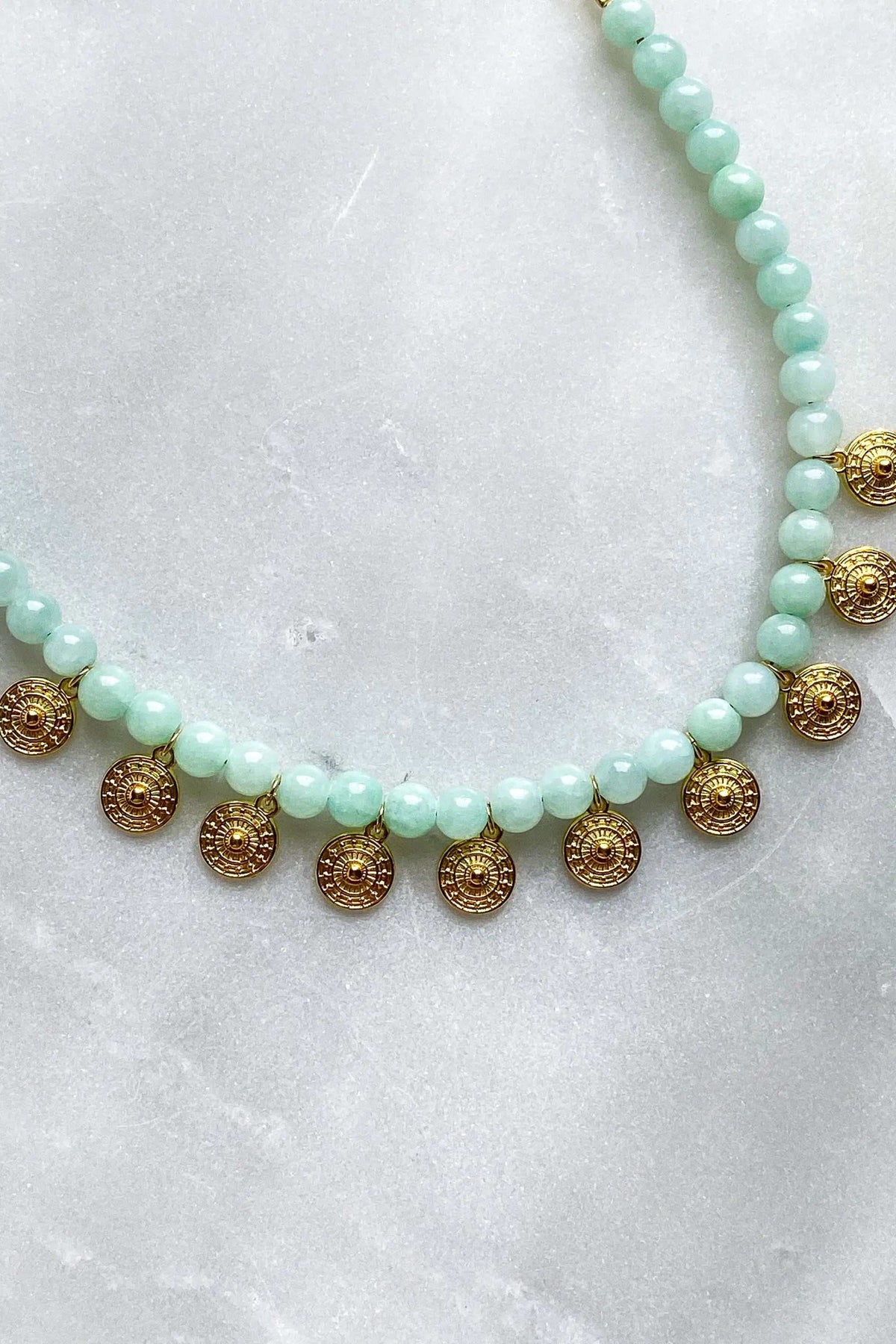 ERSA NECKLACE with pale mint green round beads, a gold-tone chain and small ornate circular pendants