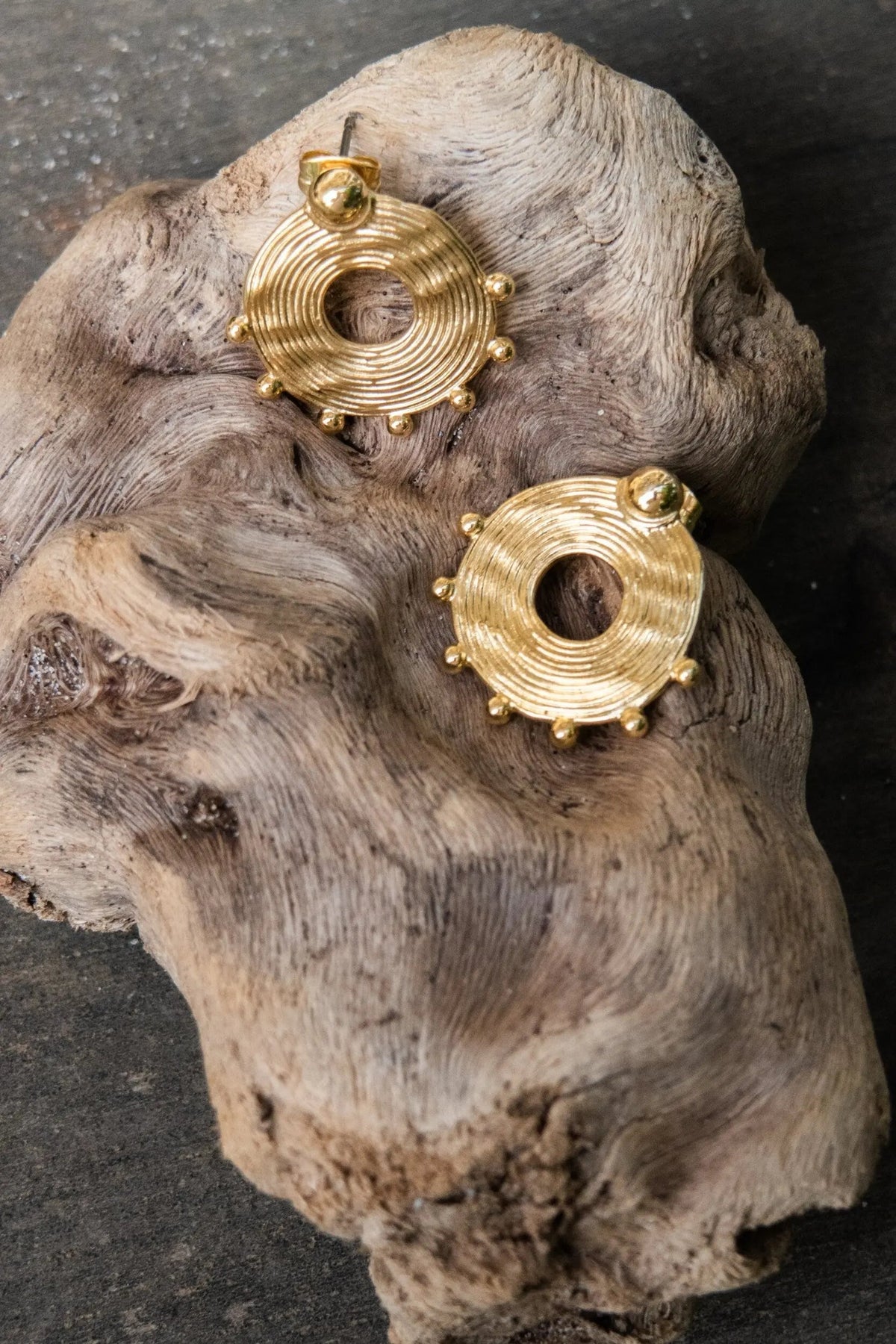 Ethnic round Earrings in gold-tone metal, featuring circular spiral ridges, open centers and tiny raised bead accents