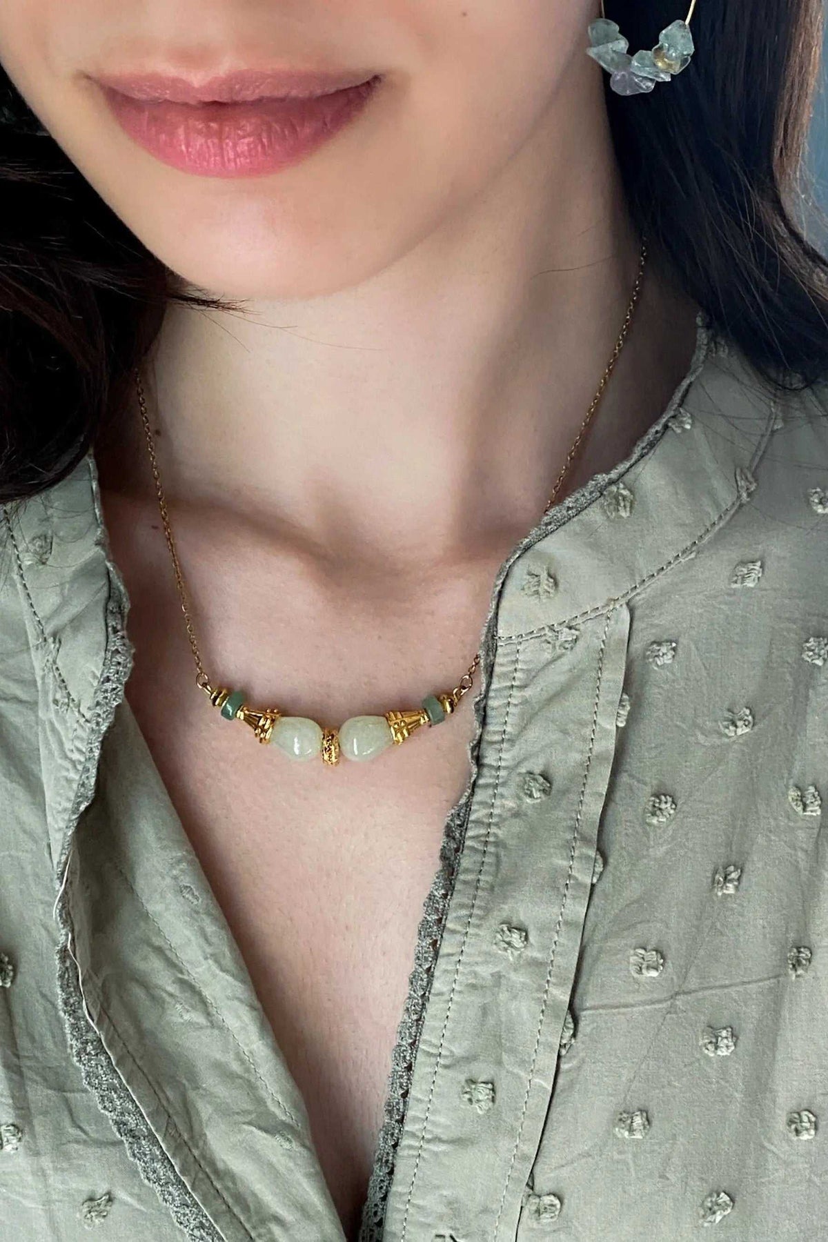 EUPHORIA Gemstone Necklace with a gold-tone chain and pale green and cream stones, accented by tiny gold charms
