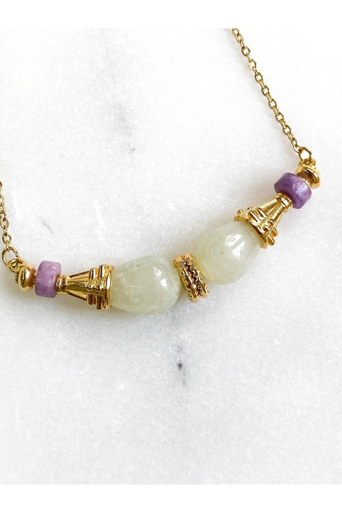 EUPHORIA Gemstone Necklace with gold-tone chain, pale green gemstone beads, purple accents and ornate pendant