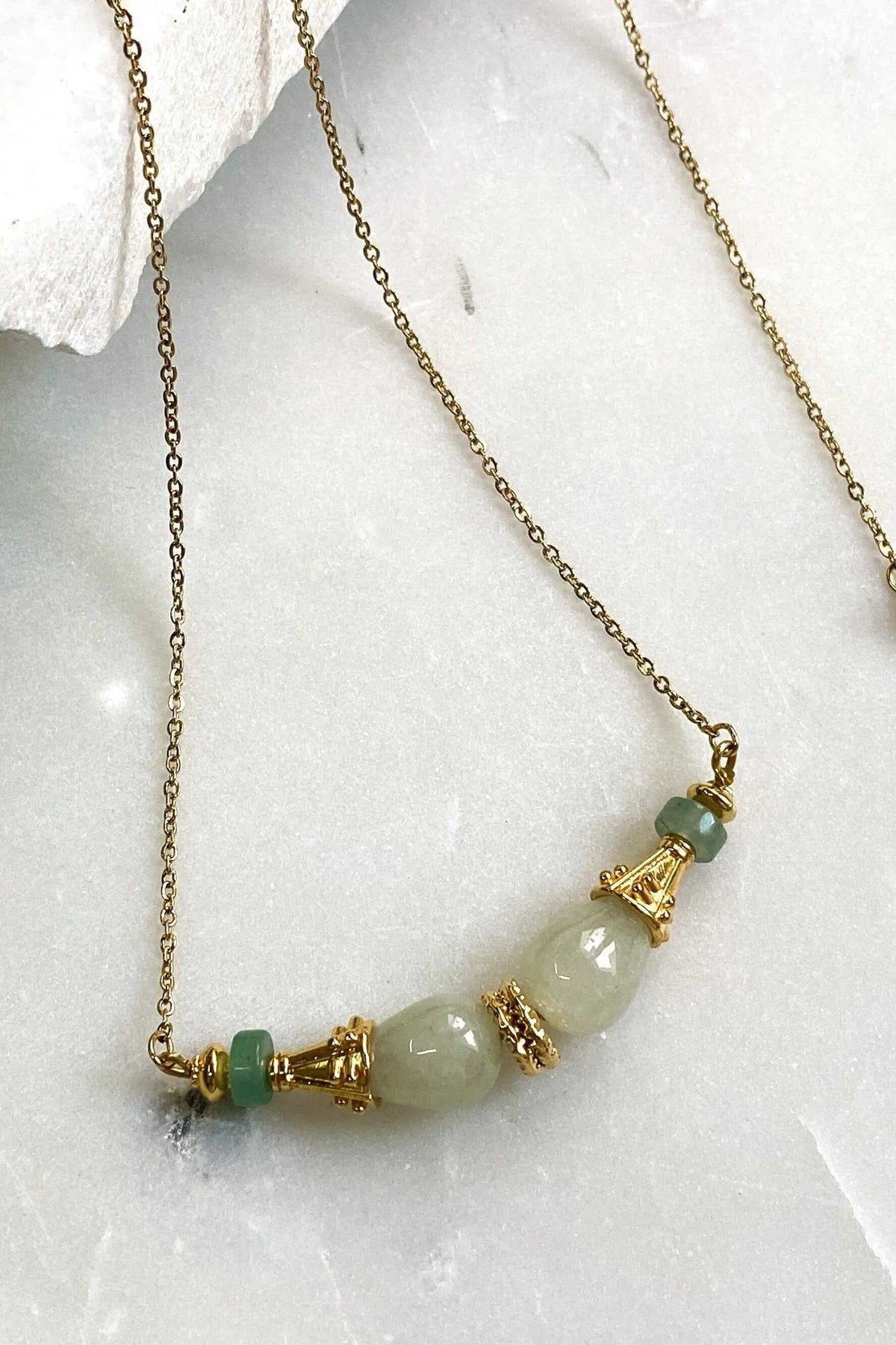 EUPHORIA Gemstone Necklace with a gold-tone chain and pale green polished stone beads, gold-tone spacers and a green accent bead