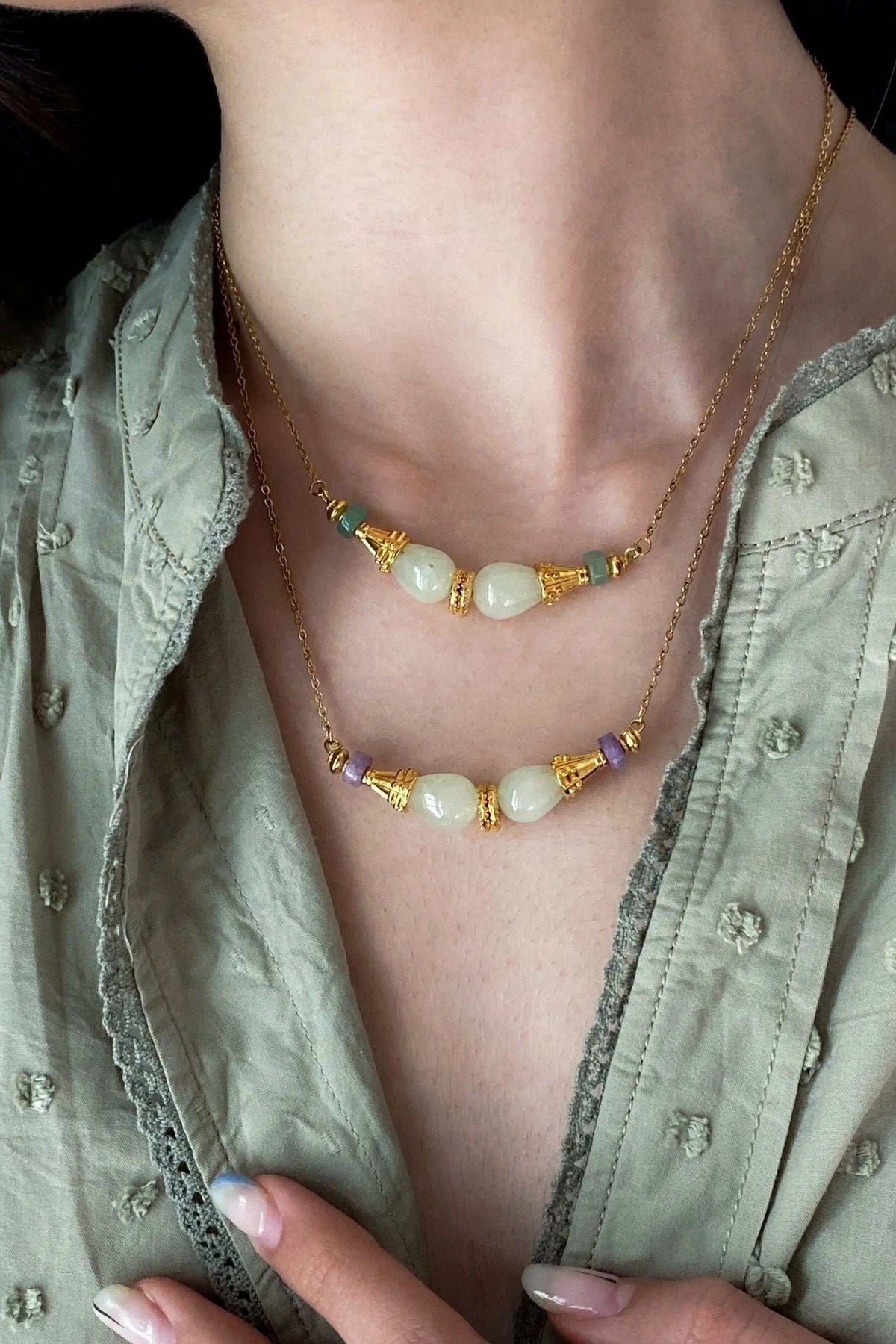 EUPHORIA Gemstone Necklace with delicate gold-tone chains, creamy white stones, and colorful accent beads in a layered design