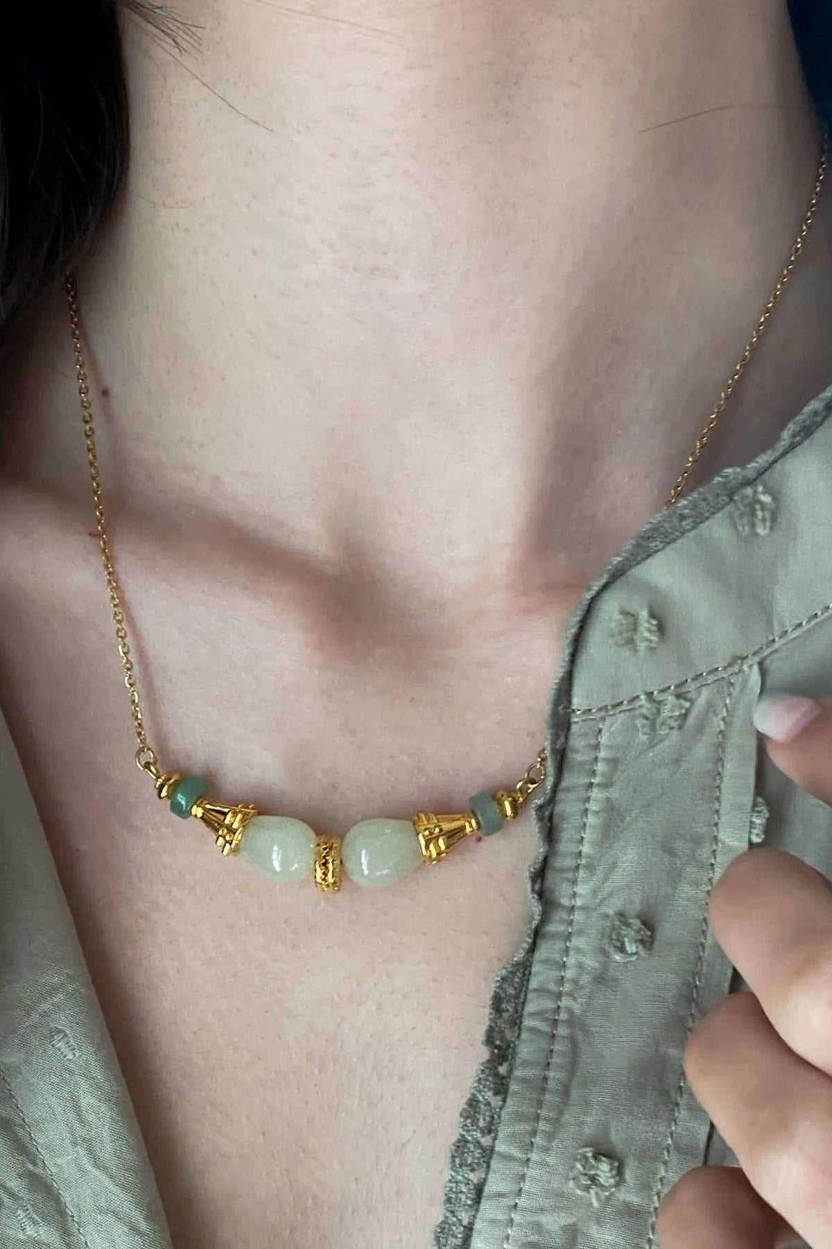 EUPHORIA Gemstone Necklace with gold-tone chain, pale green gemstone beads, and decorative gold spacer details