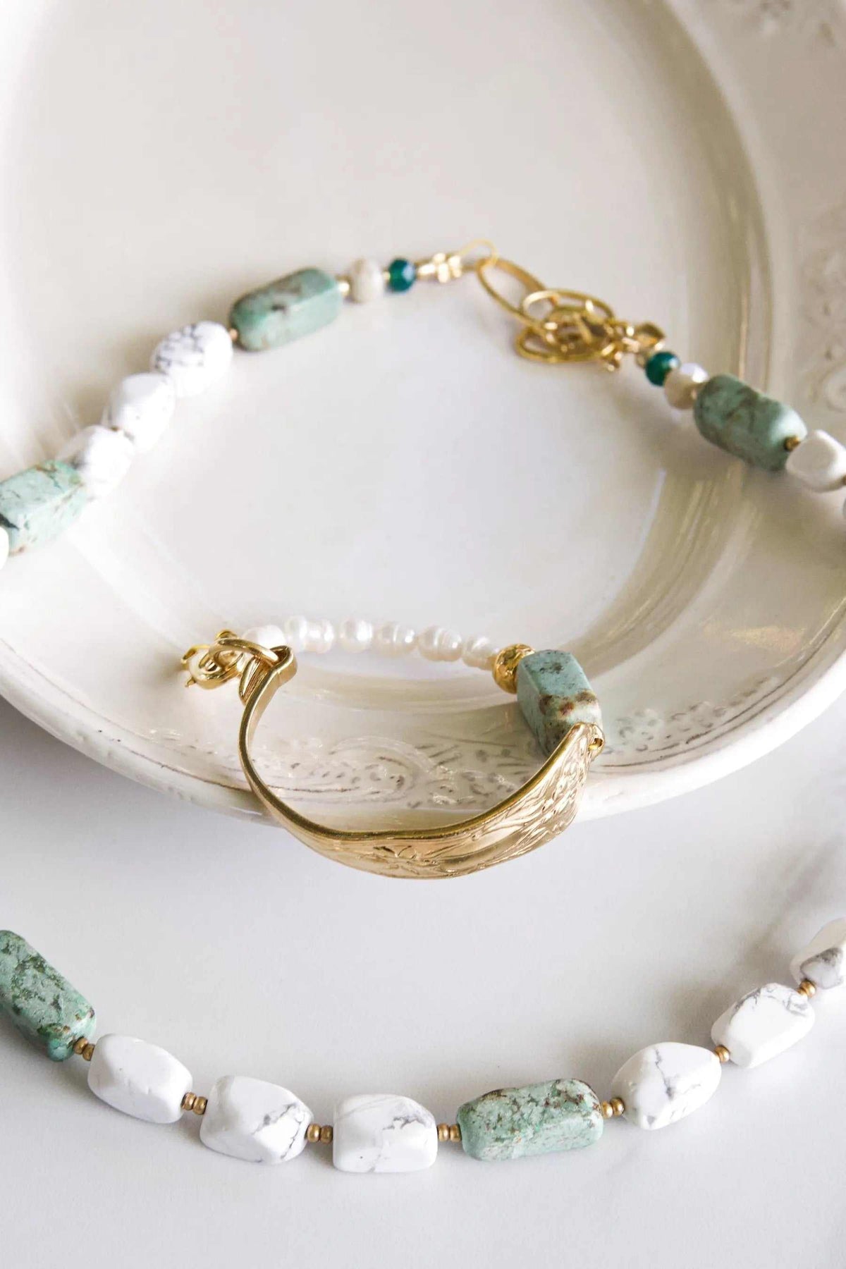 Freshwater Pearl bracelet featuring white and green stones, small pearls and polished gold-tone clasp and bar details