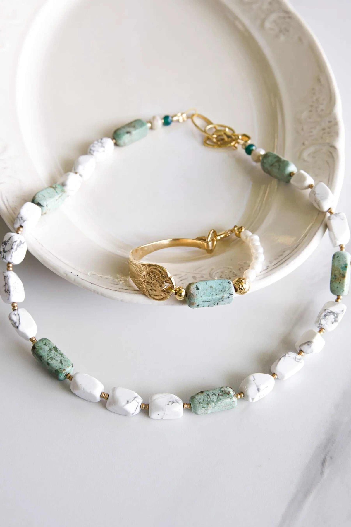 Freshwater Pearl bracelet with white marbled stones, pale green accents, gold-tone links and a heart charm