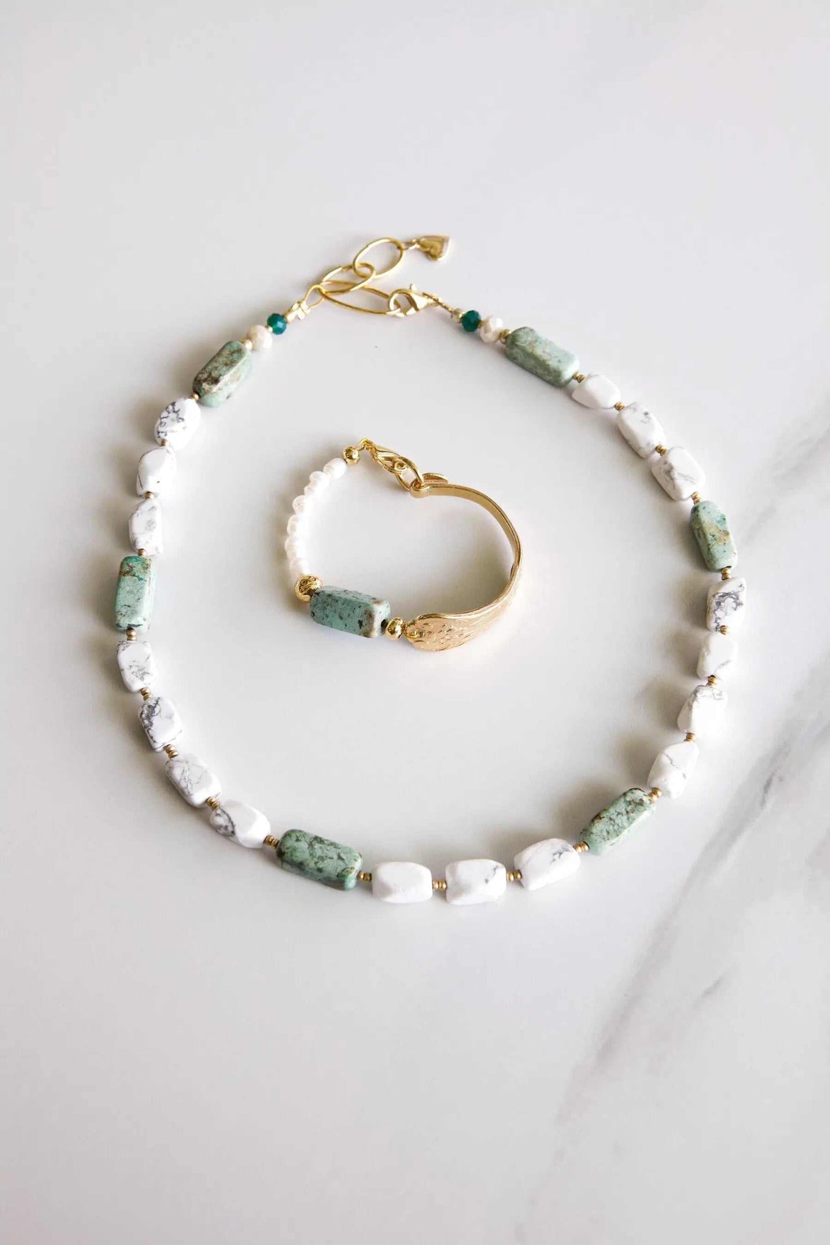 Freshwater Pearl bracelet with white pearls, mottled green stones and gold-tone fittings, shown with a matching bracelet