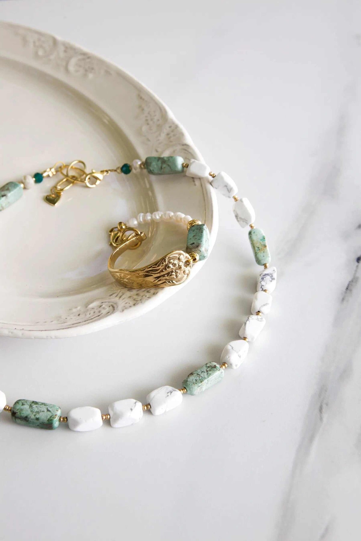 Freshwater Pearl bracelet with white pearls, green mottled stones and gold-tone accents, finished with a heart charm