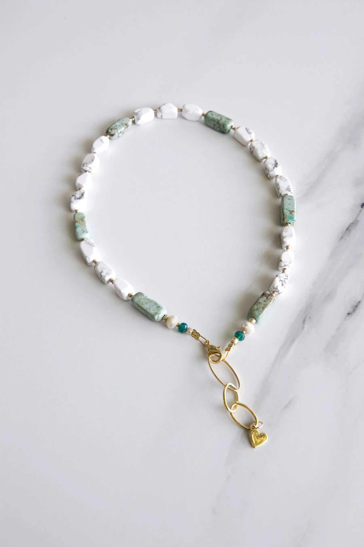 Freshwater Pearl bracelet with irregular white pearls and pale green stones, finished with gold-tone links and a heart charm