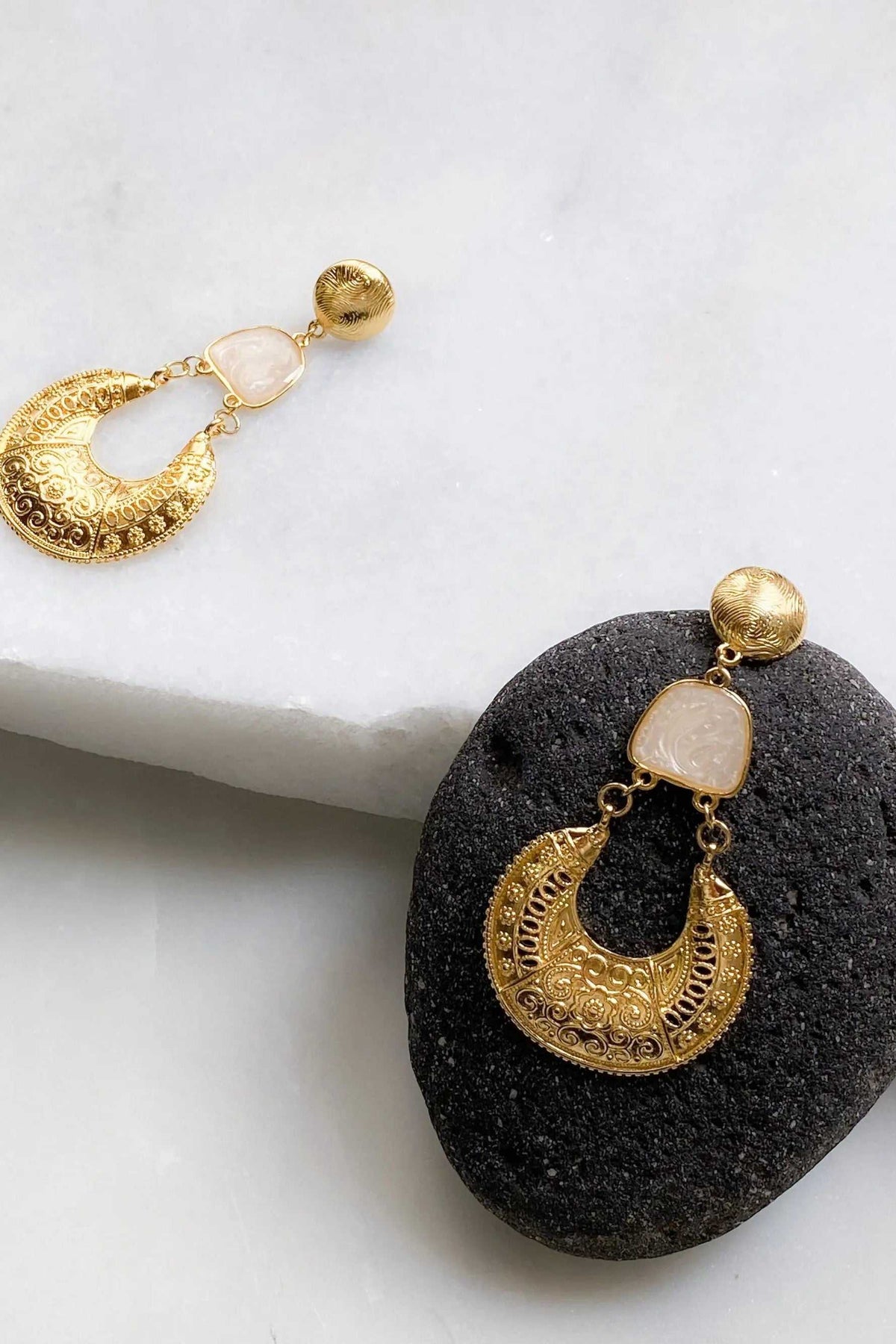 Gold Boho earrings with ornate gold filigree crescent drops, pale pink resin accents and round stud tops