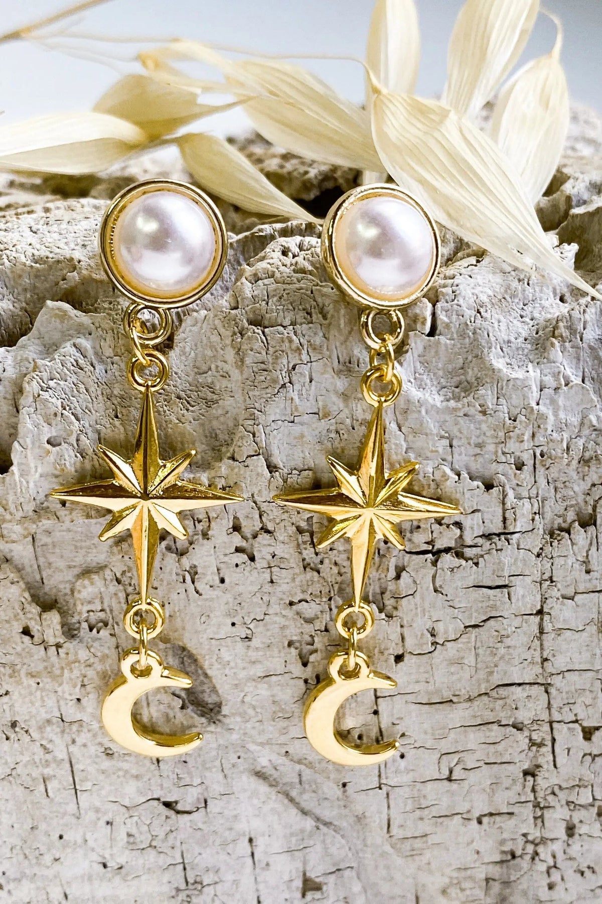 Gold celestial Earrings with round white pearl studs, gold-tone starburst charms and dangling crescent moons