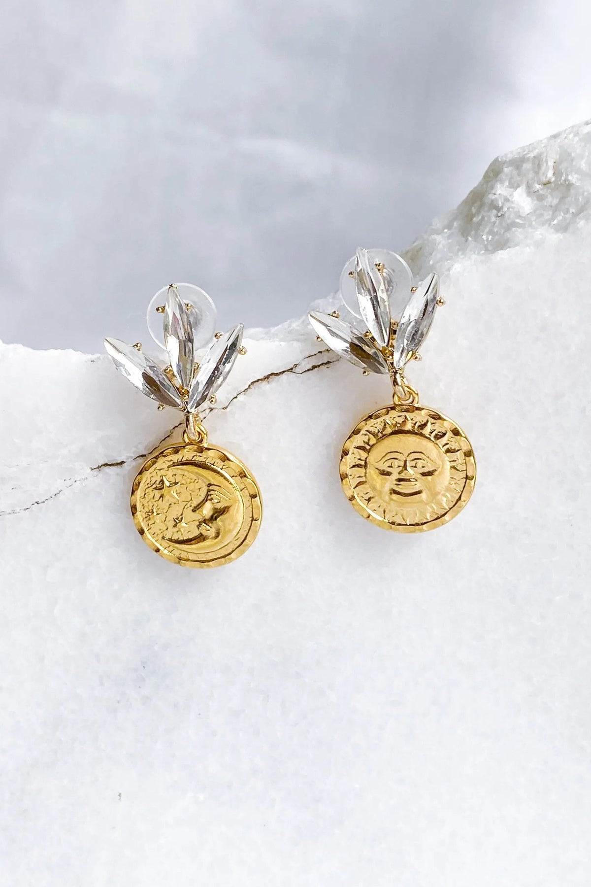 Gold Coin drop Earrings with gold-tone round embossed sun and moon coins, paired with clear crystal leaf-shaped studs.