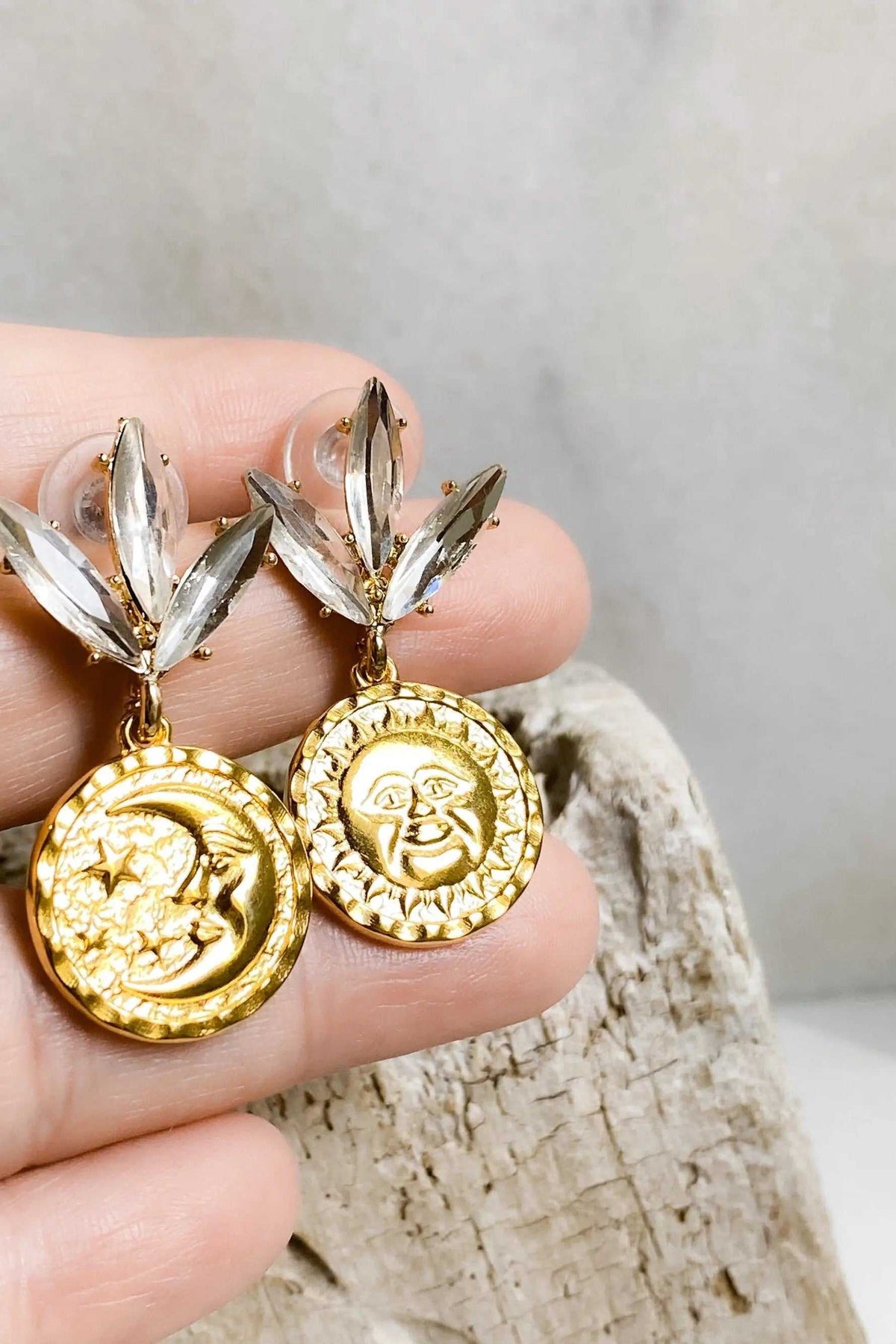Gold Coin drop Earrings with textured gold sun and moon medallions, topped with clear crystal leaf-shaped studs.