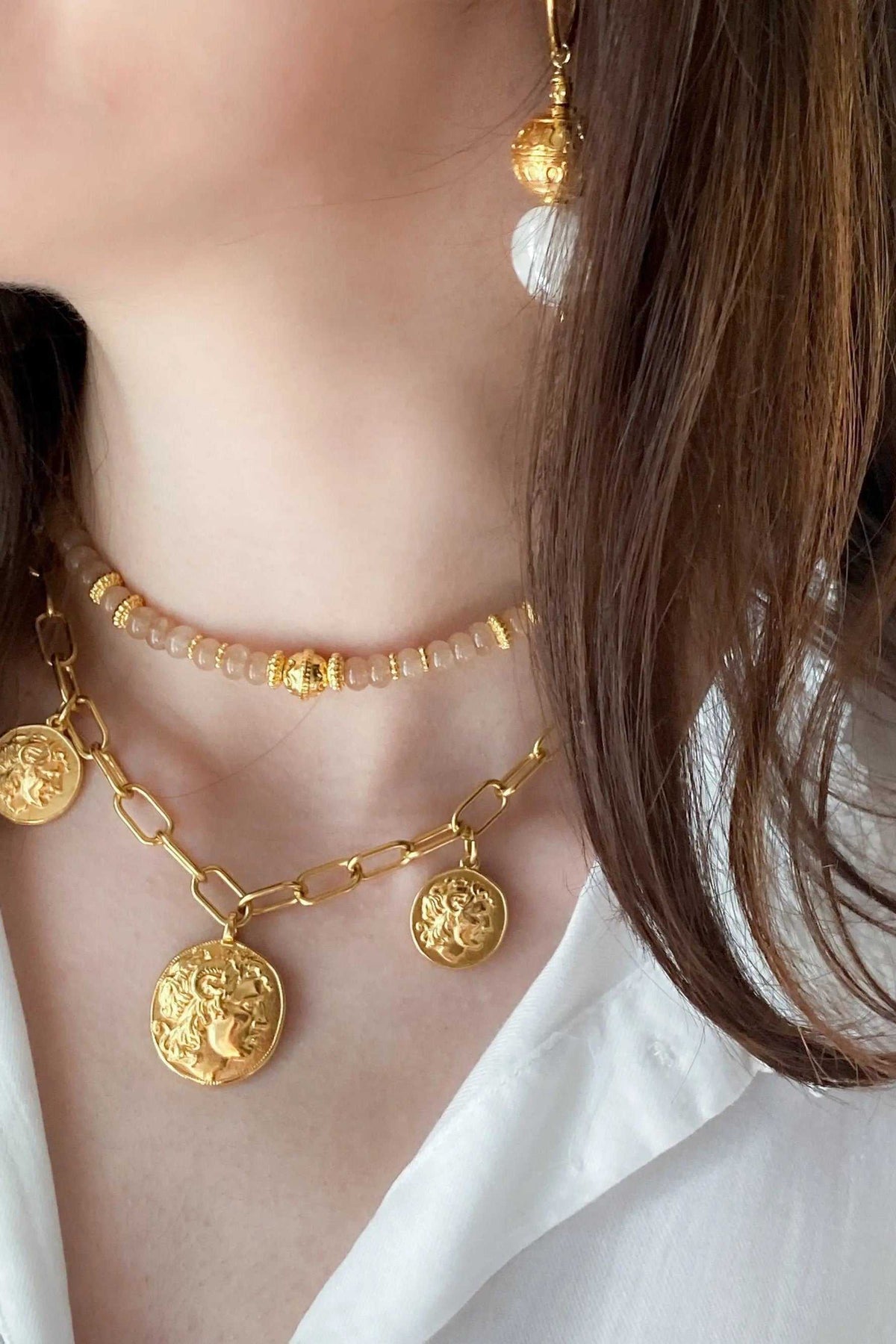 Gold Coin Necklace in gold-toned metal with chunky paperclip chain and round embossed coin pendants