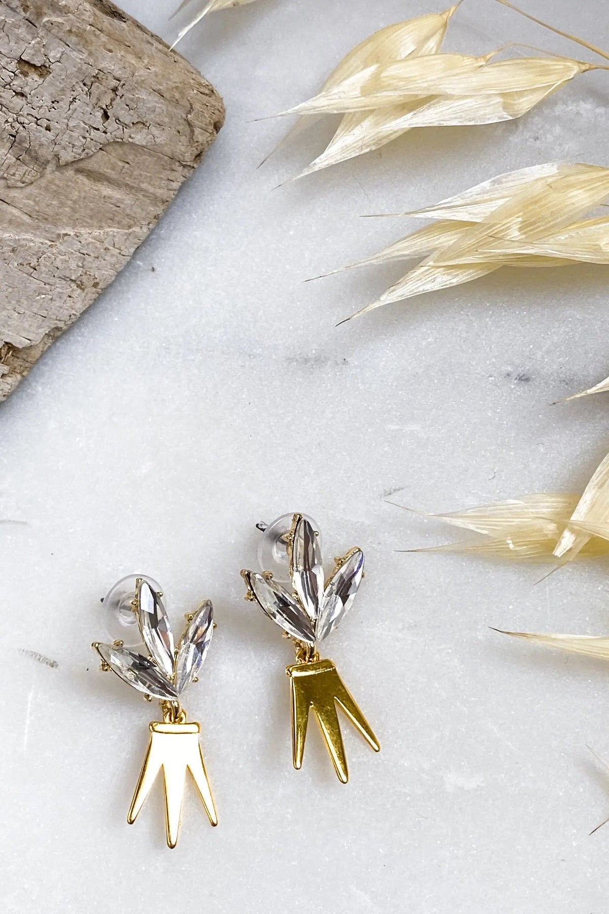 Gold Crown Earrings with clear crystal leaf-shaped studs and polished gold geometric crown drops with pointed tips