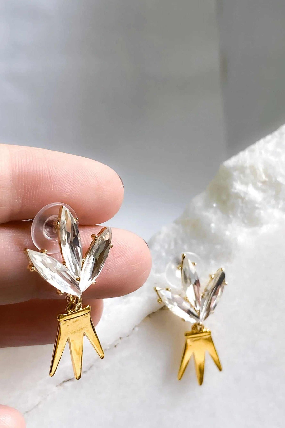 Gold Crown Earrings in gold-tone metal with clear crystal leaf-like stones and a distinctive pointed crown drop