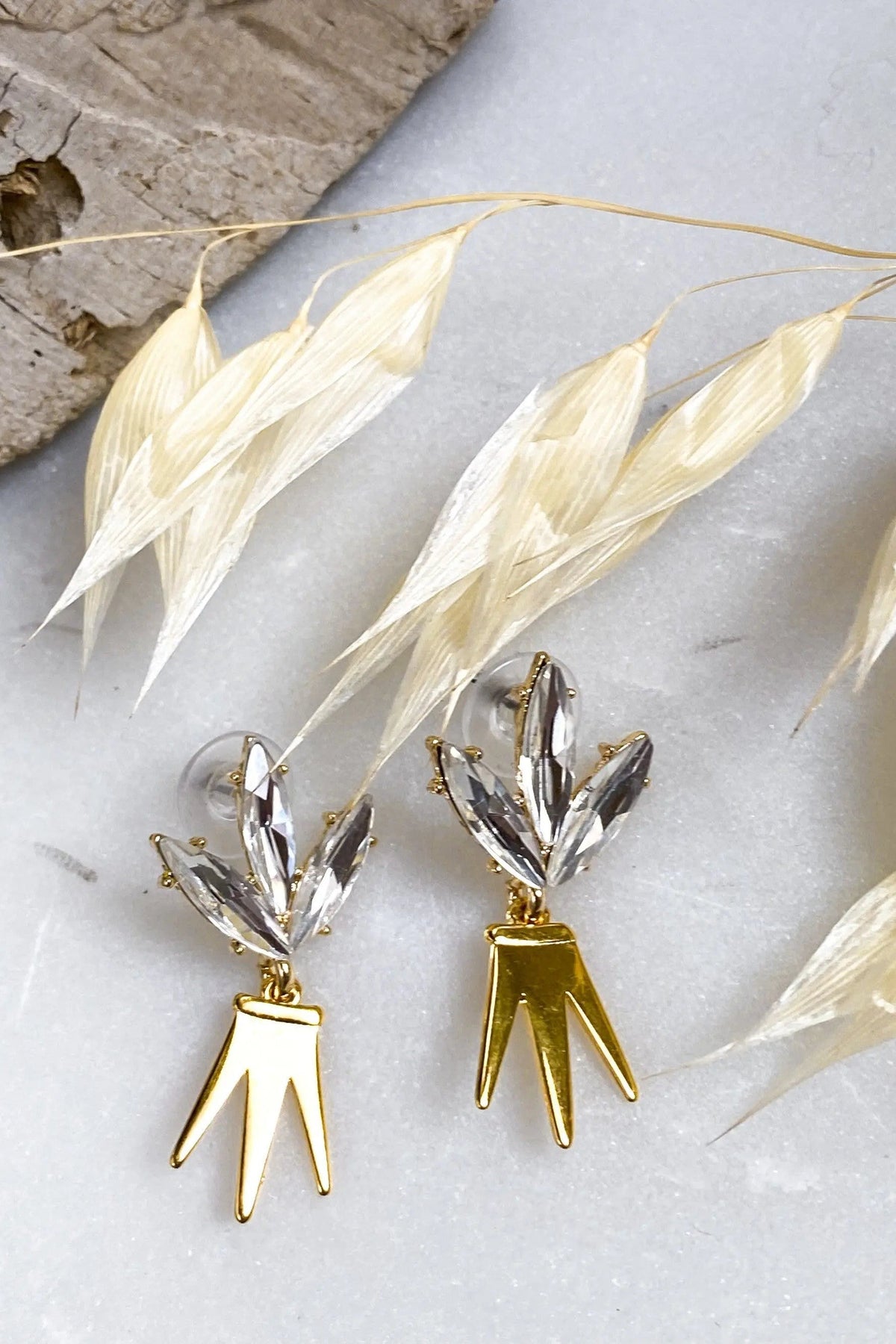 Gold Crown Earrings with polished gold-tone pointed crown drops and clear crystal leaf-shaped studs