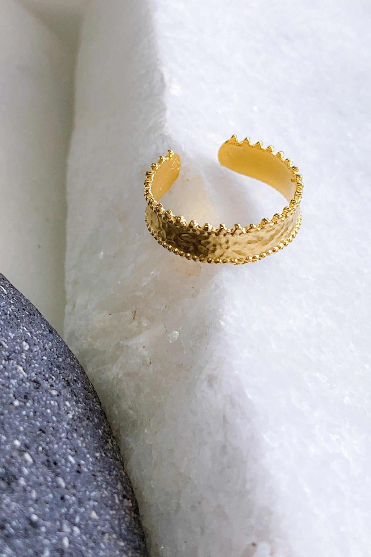 Gold dainty ring with a textured band, raised beaded details and delicate scalloped lace edges in a warm gold finish