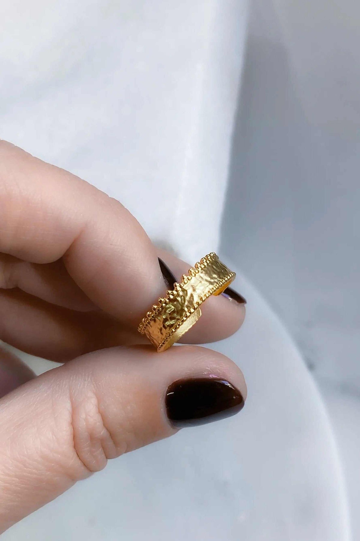 Gold dainty ring in a textured gold-tone finish, featuring a delicate band with ornate scalloped lace edges